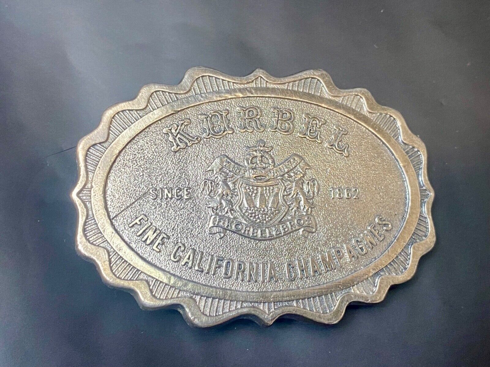 vintage Korbel Fine California champagne belt buckle by Wyoming Studio Art