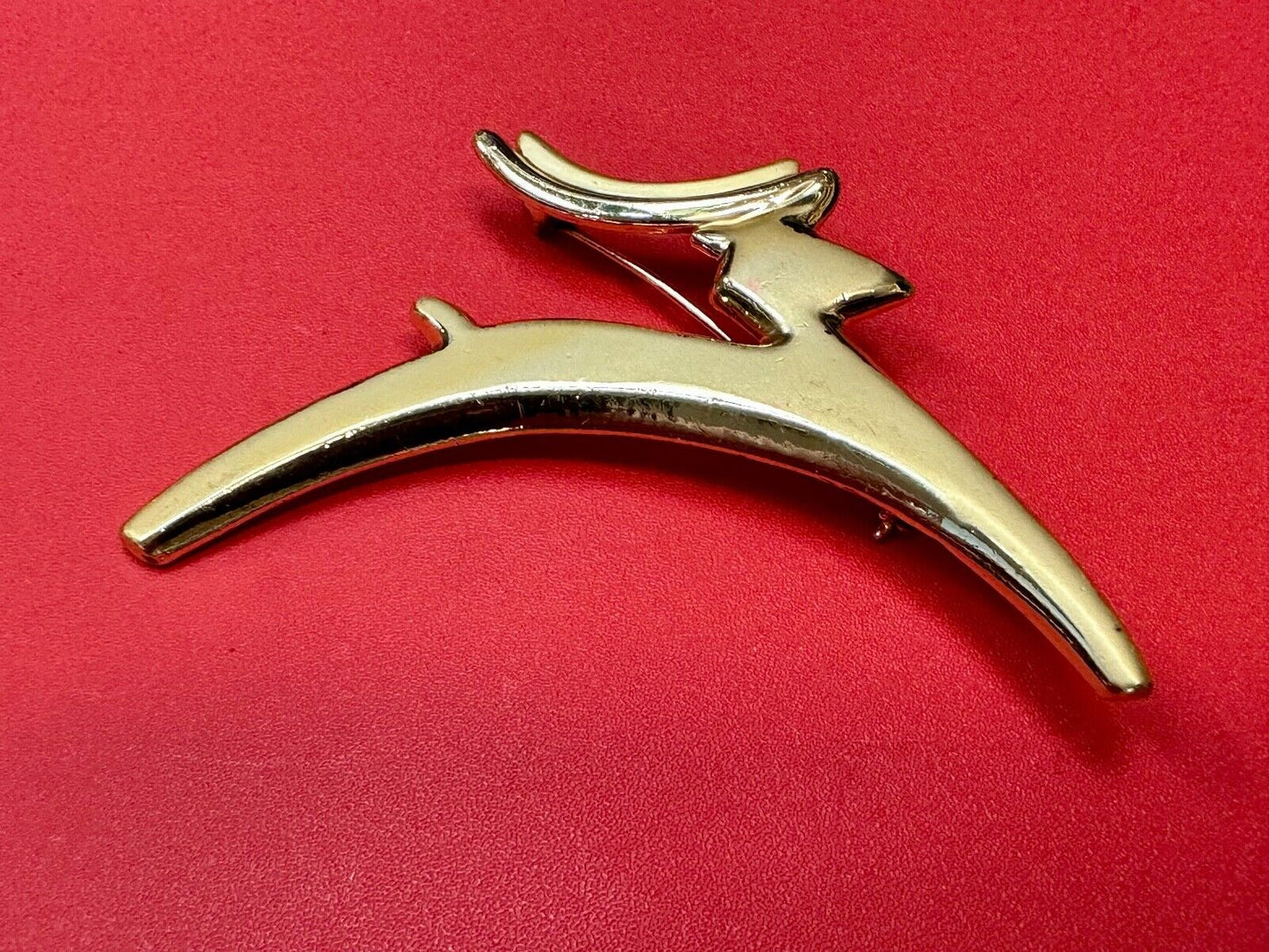 Abstract gold tone running deer - Vintage Christmas Holliday Brooch by AJC