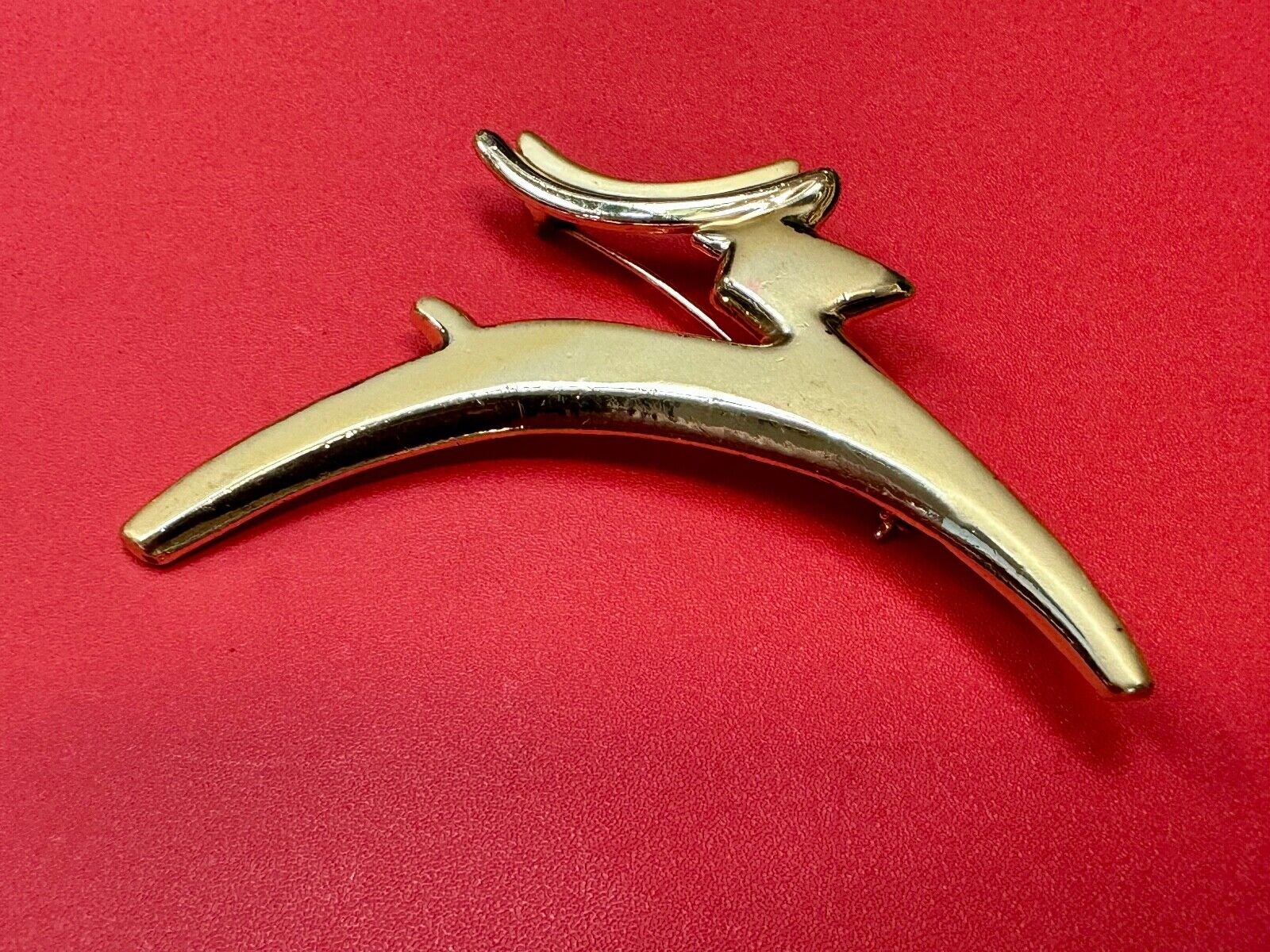 Abstract gold tone running deer - Vintage Christmas Holliday Brooch by AJC