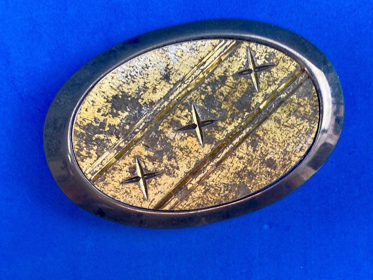 Unique XXX gold tone belt buckle tic tac toe pattern
