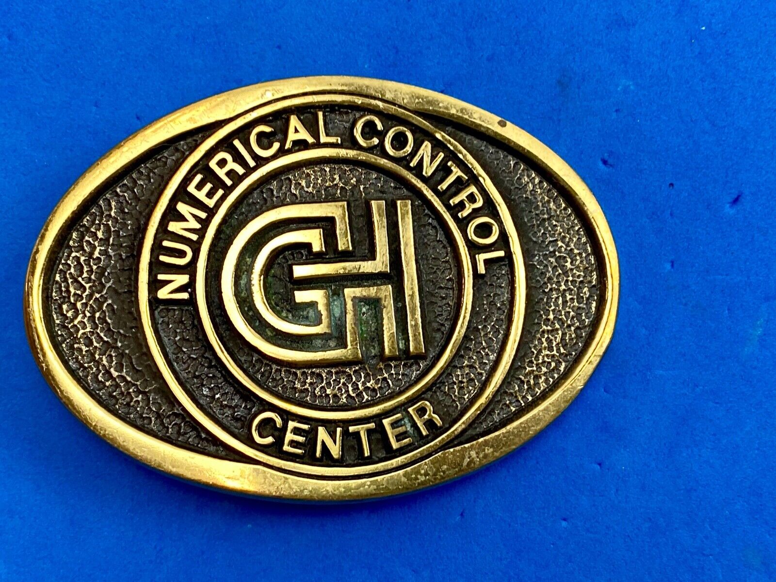 Vintage GH Numerical Control Center solid brass belt buckle by Blue Bayou 