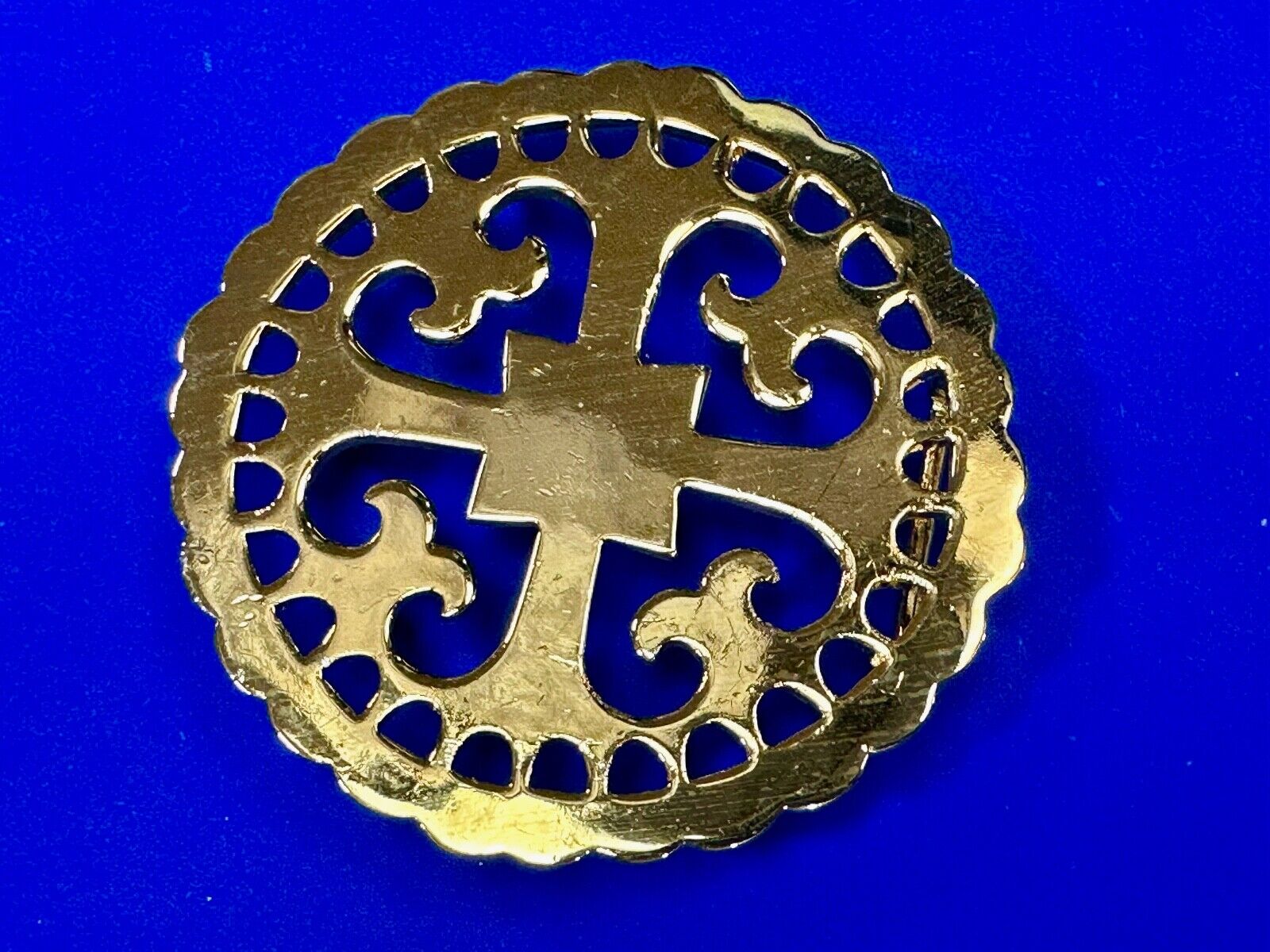 vintage Celtic pattern round cutout belt buckle by designer Ann Lansing