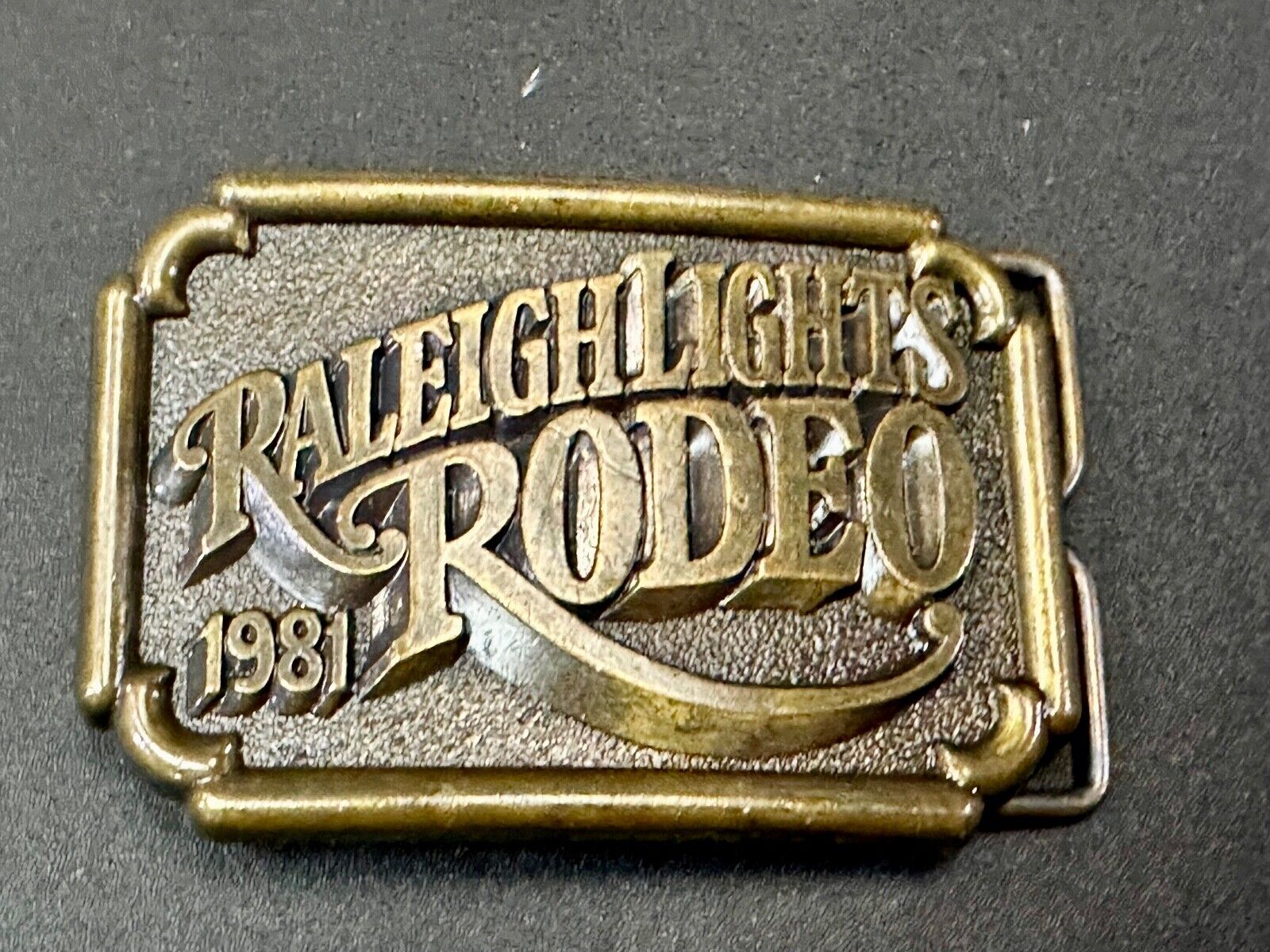 Vintage 1981 RALEIGH LIGHTS RODEO CIGARETTES SPONSOR Brass tone belt buckle