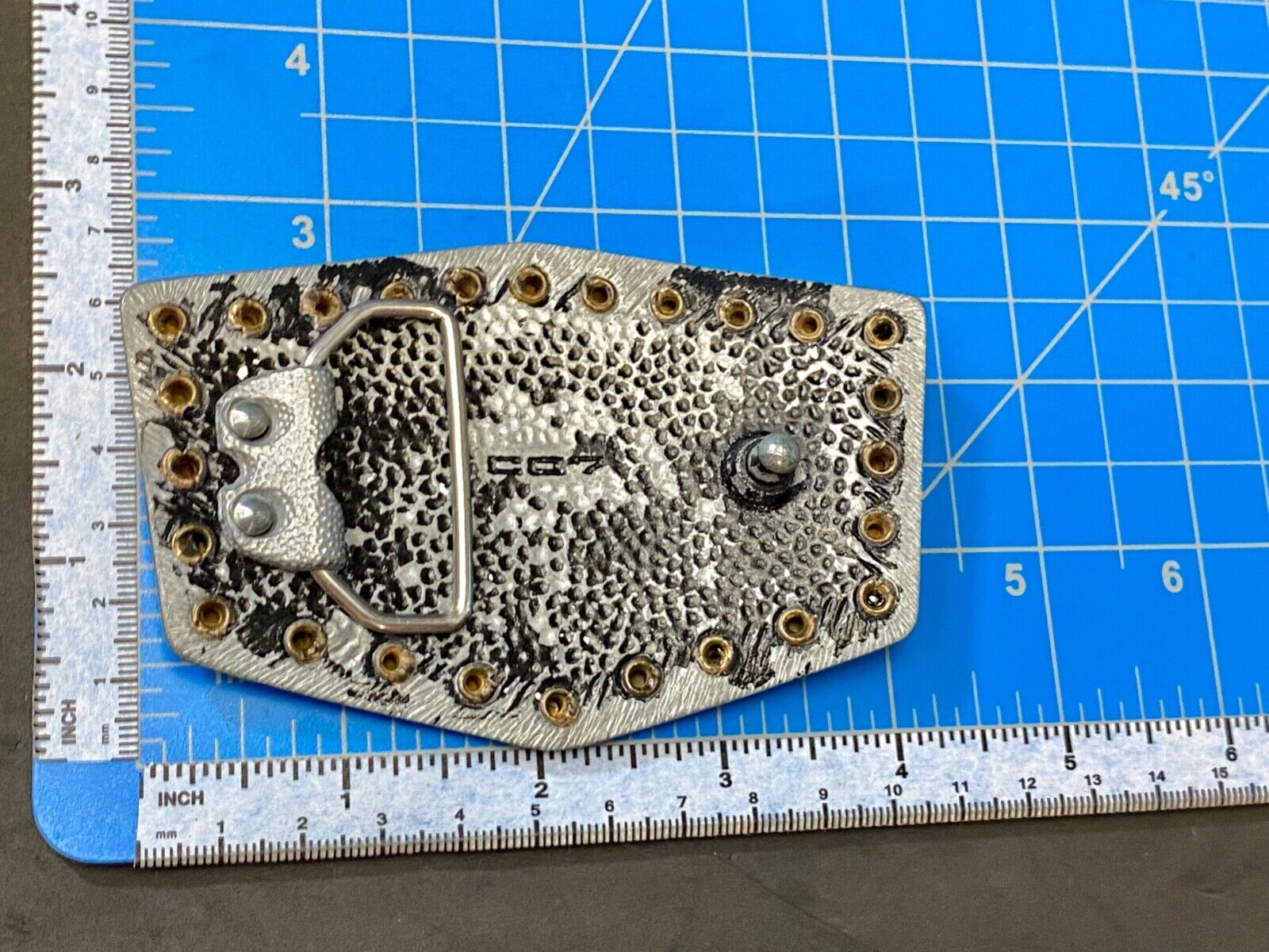 used metal studded black faded paint belt buckle for your craft or project