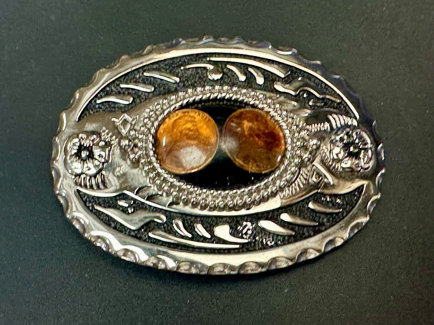 Two lucky pennies coins encased in cab style centerpiece of western belt buckle