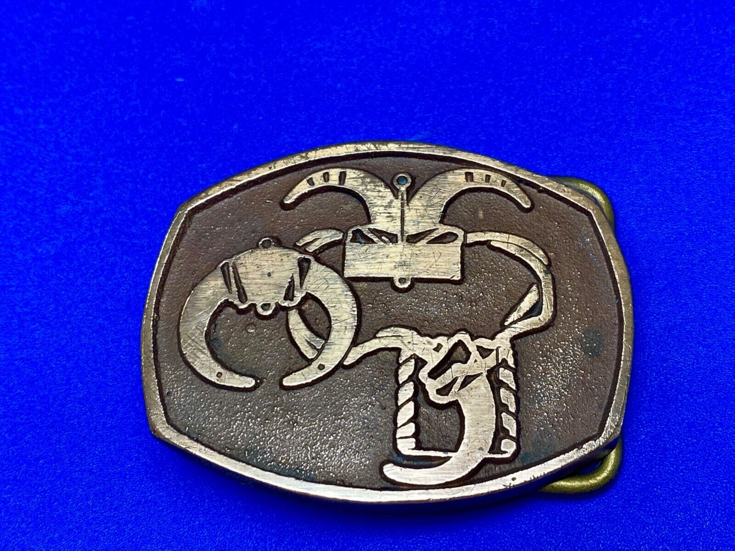 unknown to me - cattle branding symbols? longhorn western? belt buckle
