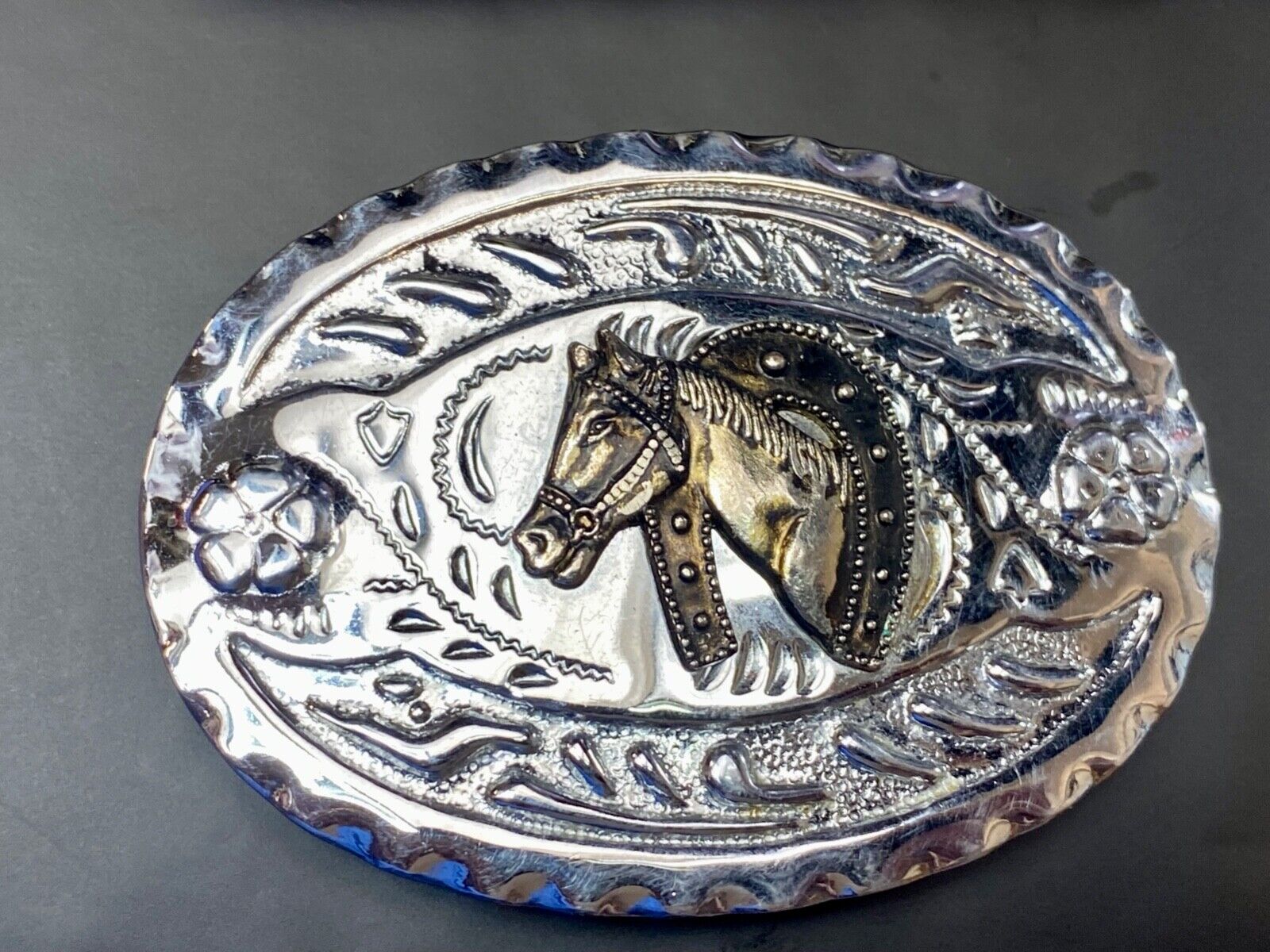 Vintage horse head through lucky horseshoe on mixed metal western belt buckle