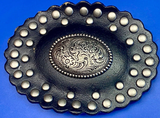 4" wide studded black leather oval belt buckle with flower swirl center