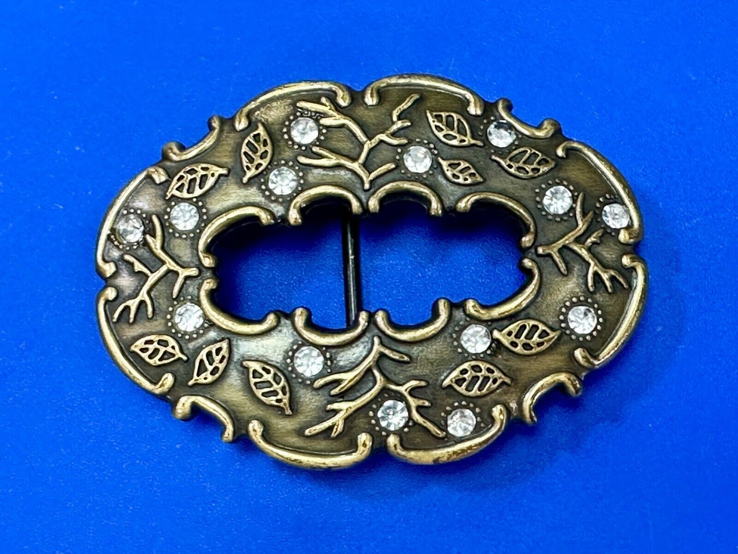 3" wide brown rhinestone accented leaf pattern semi oval belt buckle