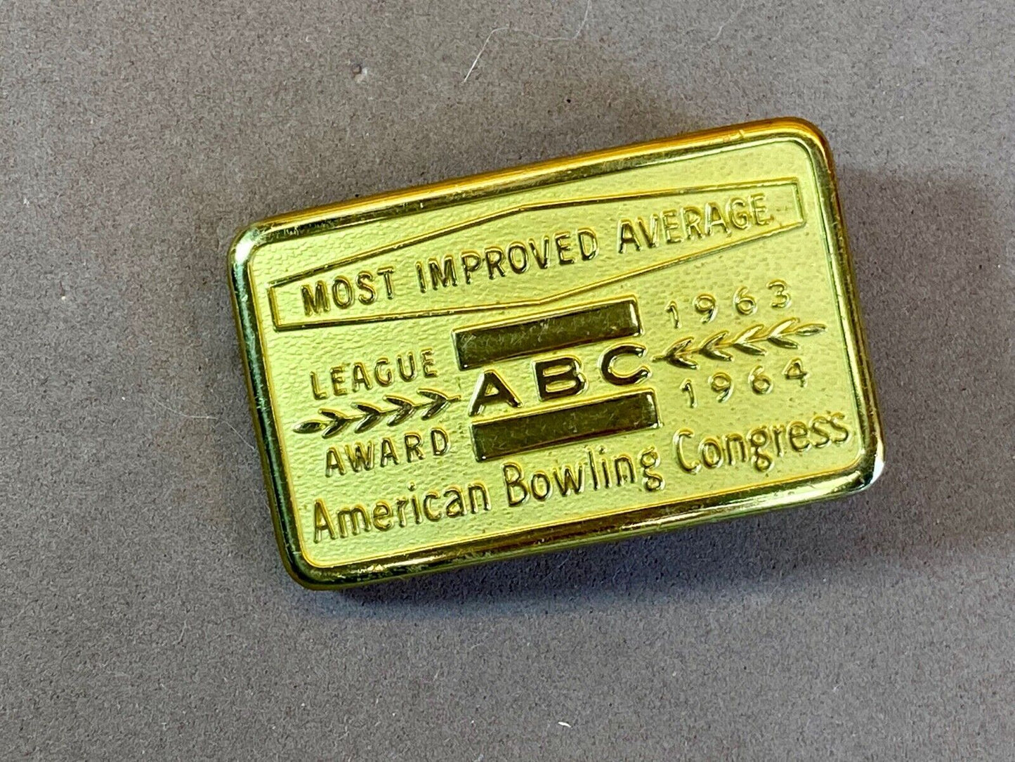 1963, 64 American Bowling Congress Most Improved Average Award Belt Buckle