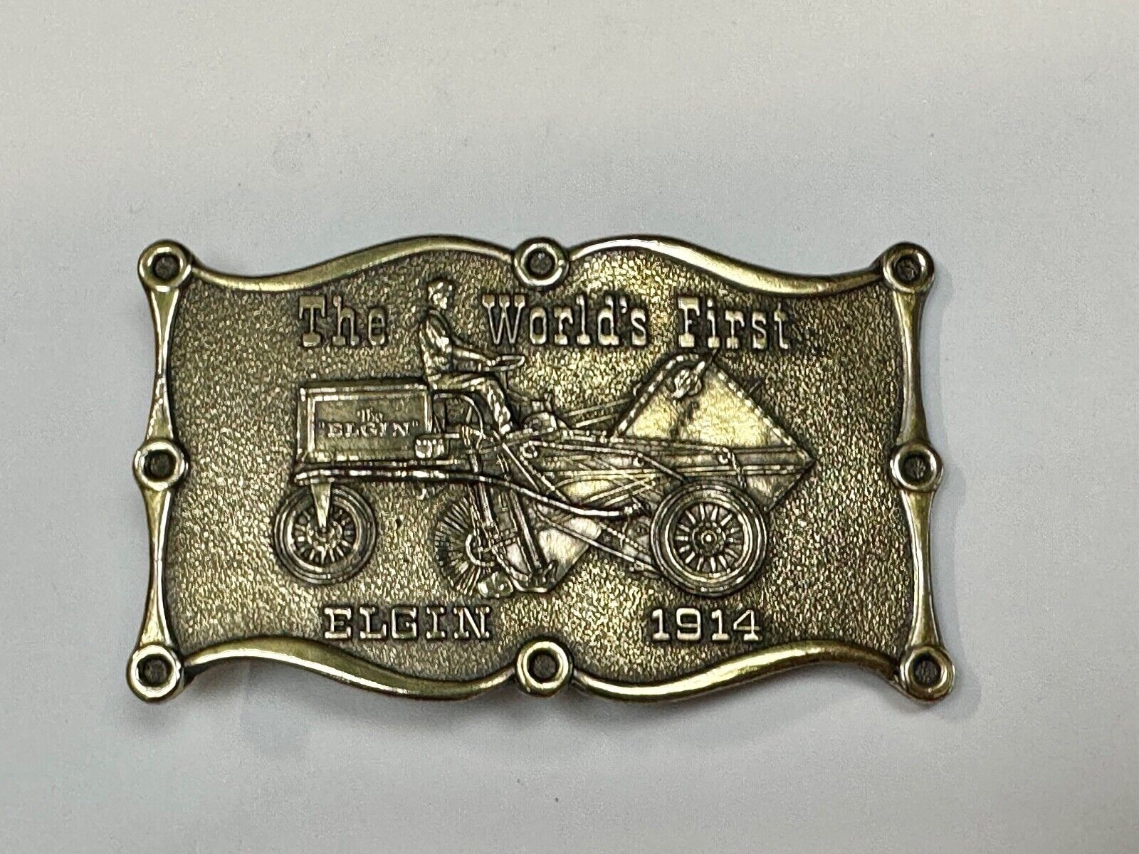 The Elgin, The worlds first tree sweeper commemorative belt buckle by Lewis