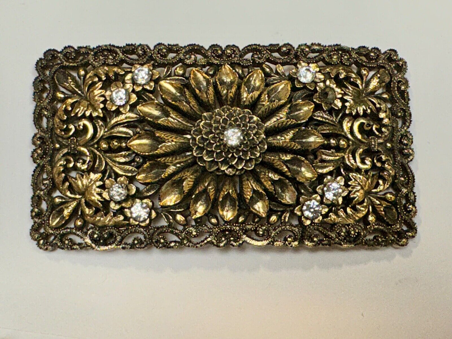 Antique gold tone? Flower theme Rhinestone covered scarf slide belt loupe buckle