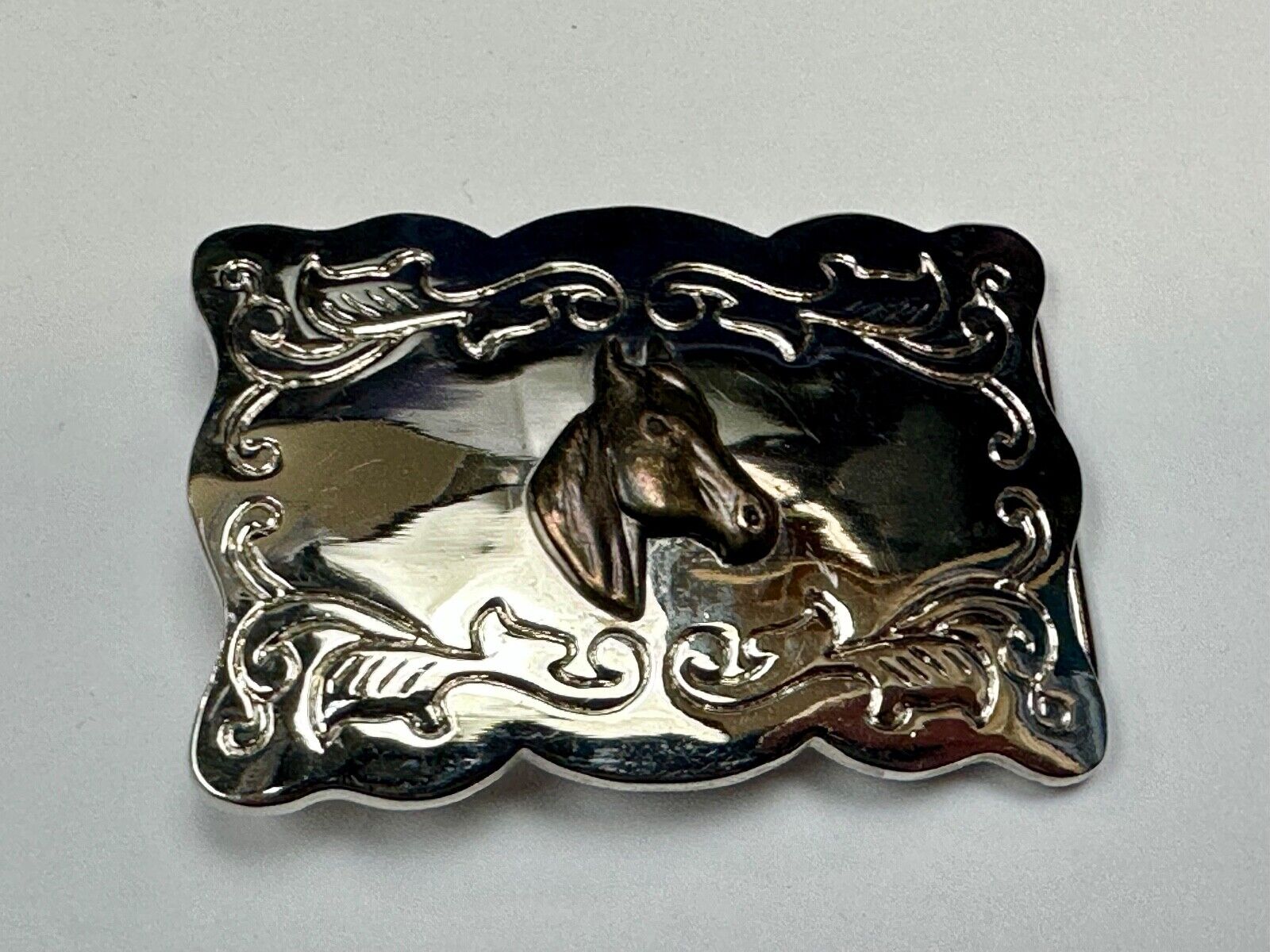 Vintage horse head centered on western rectangular two tone belt buckle