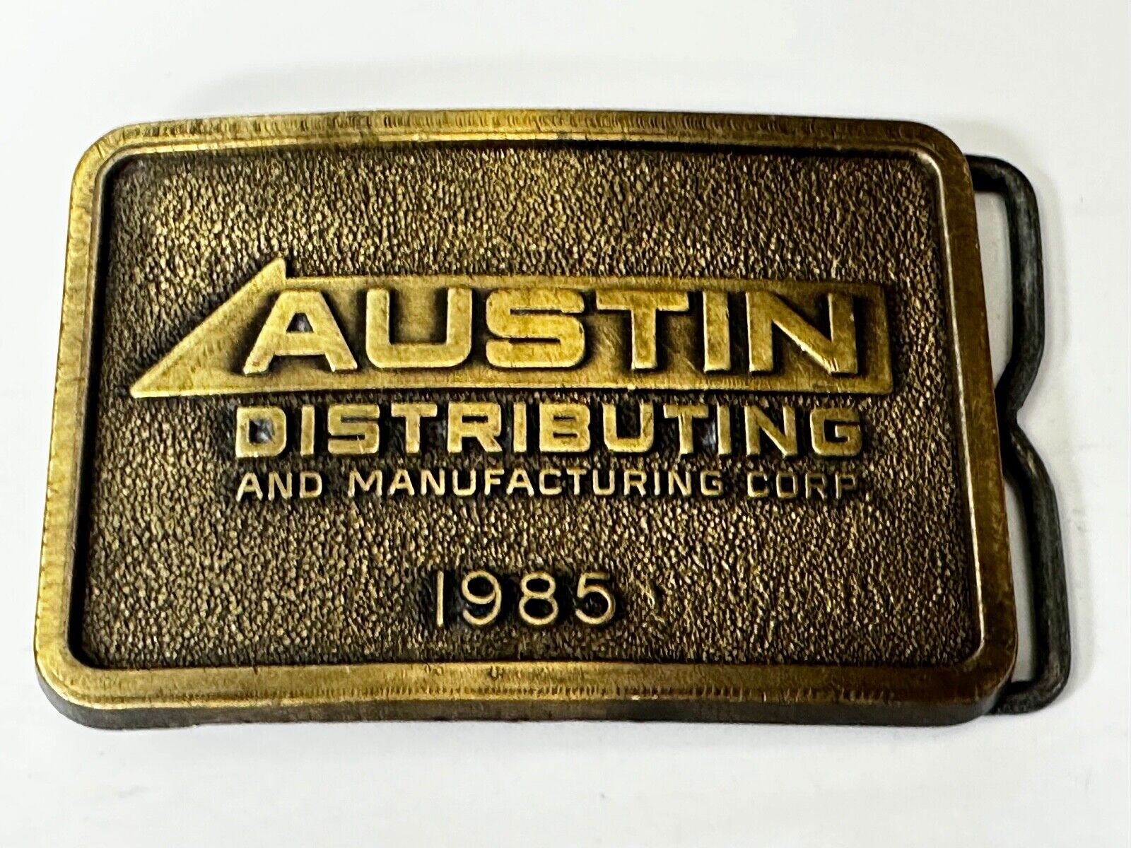 Austin Texas Distributing and Manufacturing 1985 Advertisement Promo Belt Buckle