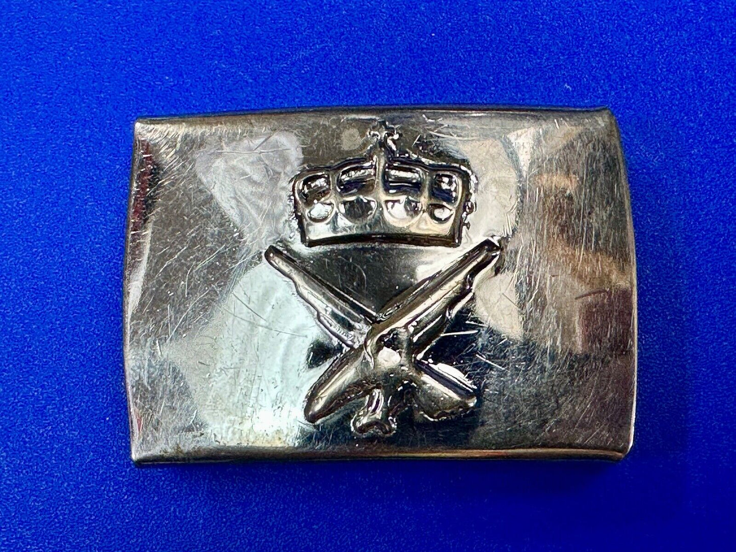 unknown to me!   dress style silver tone crown X crest? stamped belt buckle