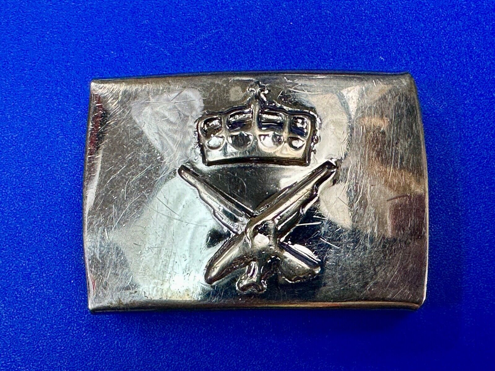 unknown to me!   dress style silver tone crown X crest? stamped belt buckle