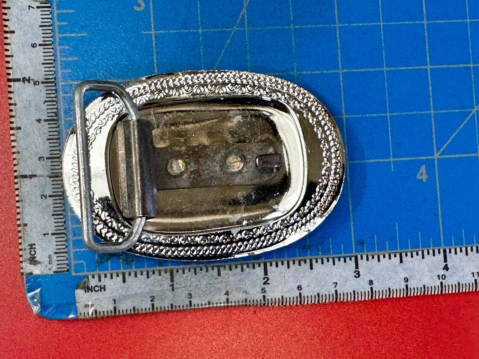 70s Covered Wagon two tone reflective oval ornate boarder belt buckle