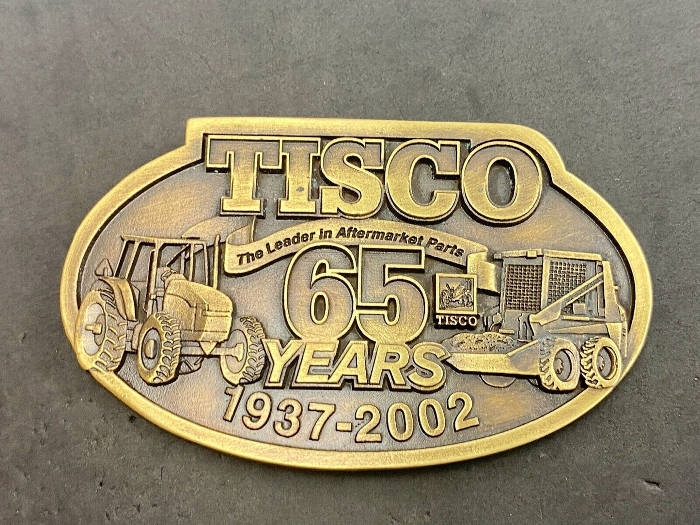 65 years - Tisco Tractor Implement Supply Spec Cast Farming Belt Buckle 