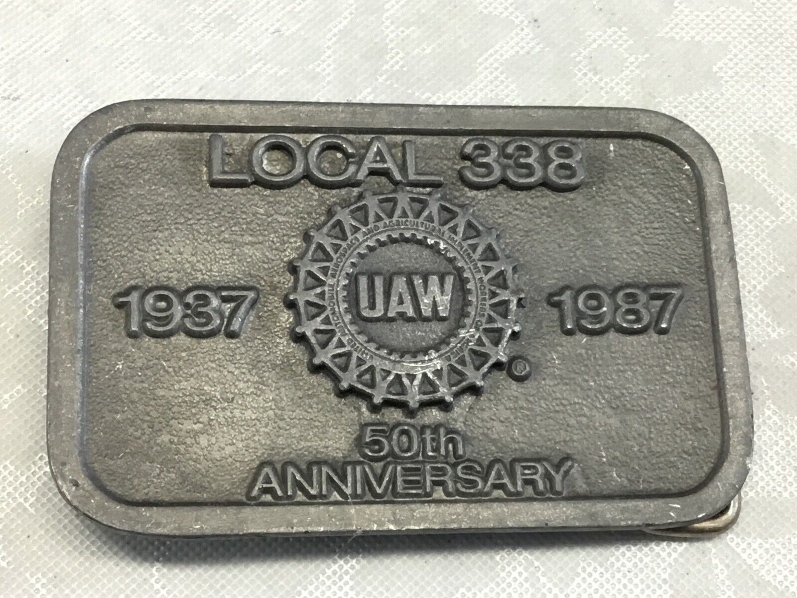 UAW Local 338 belt buckle      1987 -50th aniversery United Auto Workers  