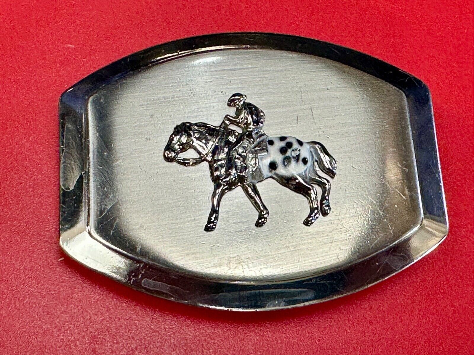 Vintage Horseback Riders cowboys belt buckle with black & white enamel accents