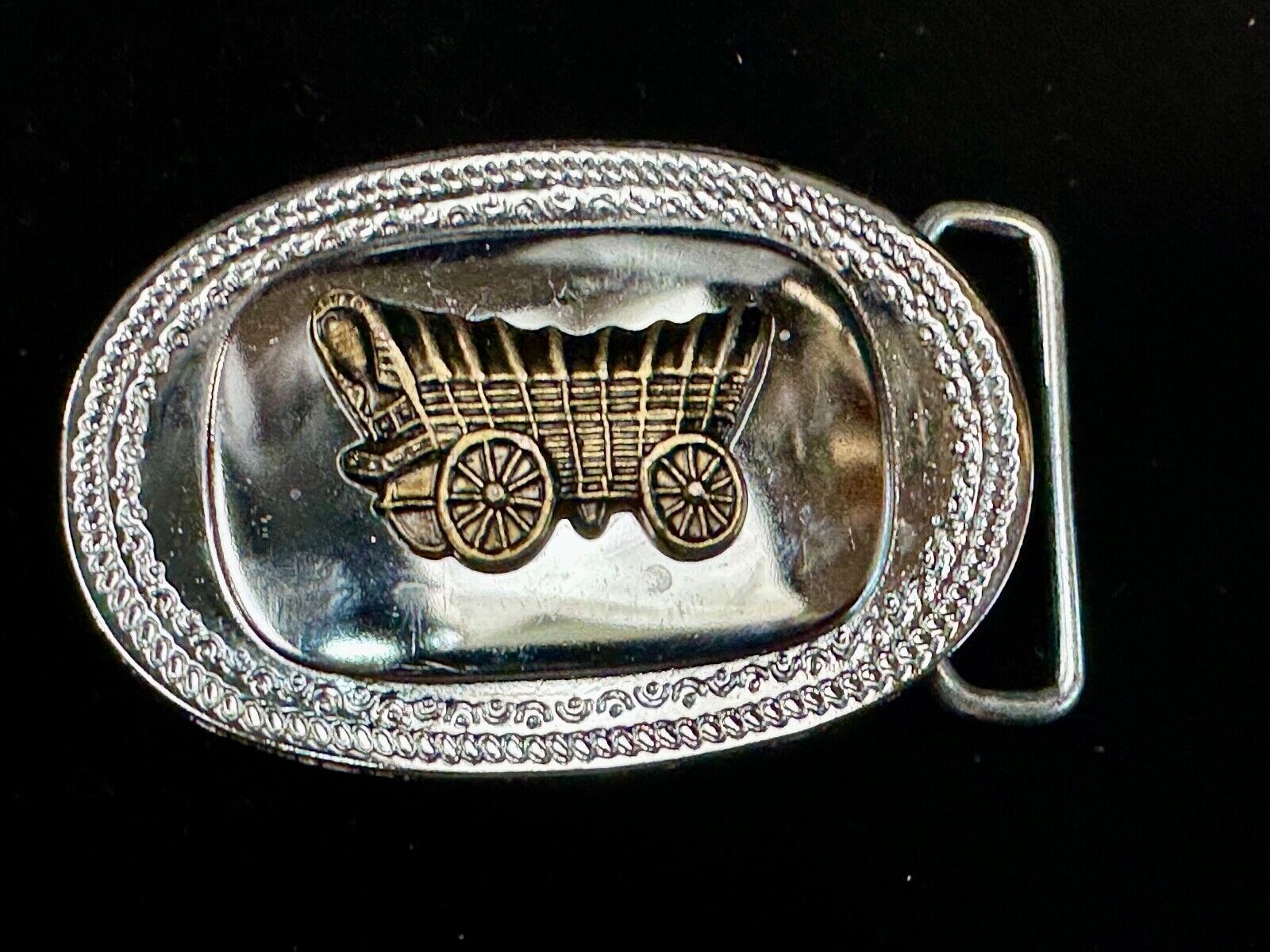 Vintage Covered Wagon on reflective oval two tone western belt buckle