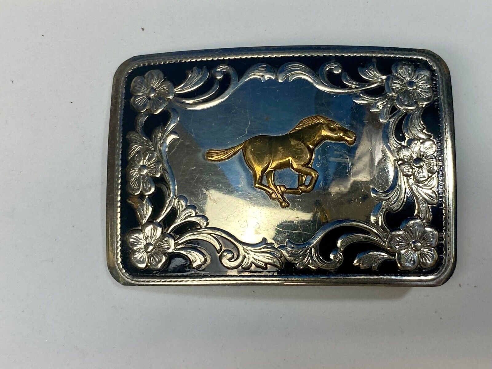 Antique Horse western Nickle Silver and black paint flower swirl belt buckle 