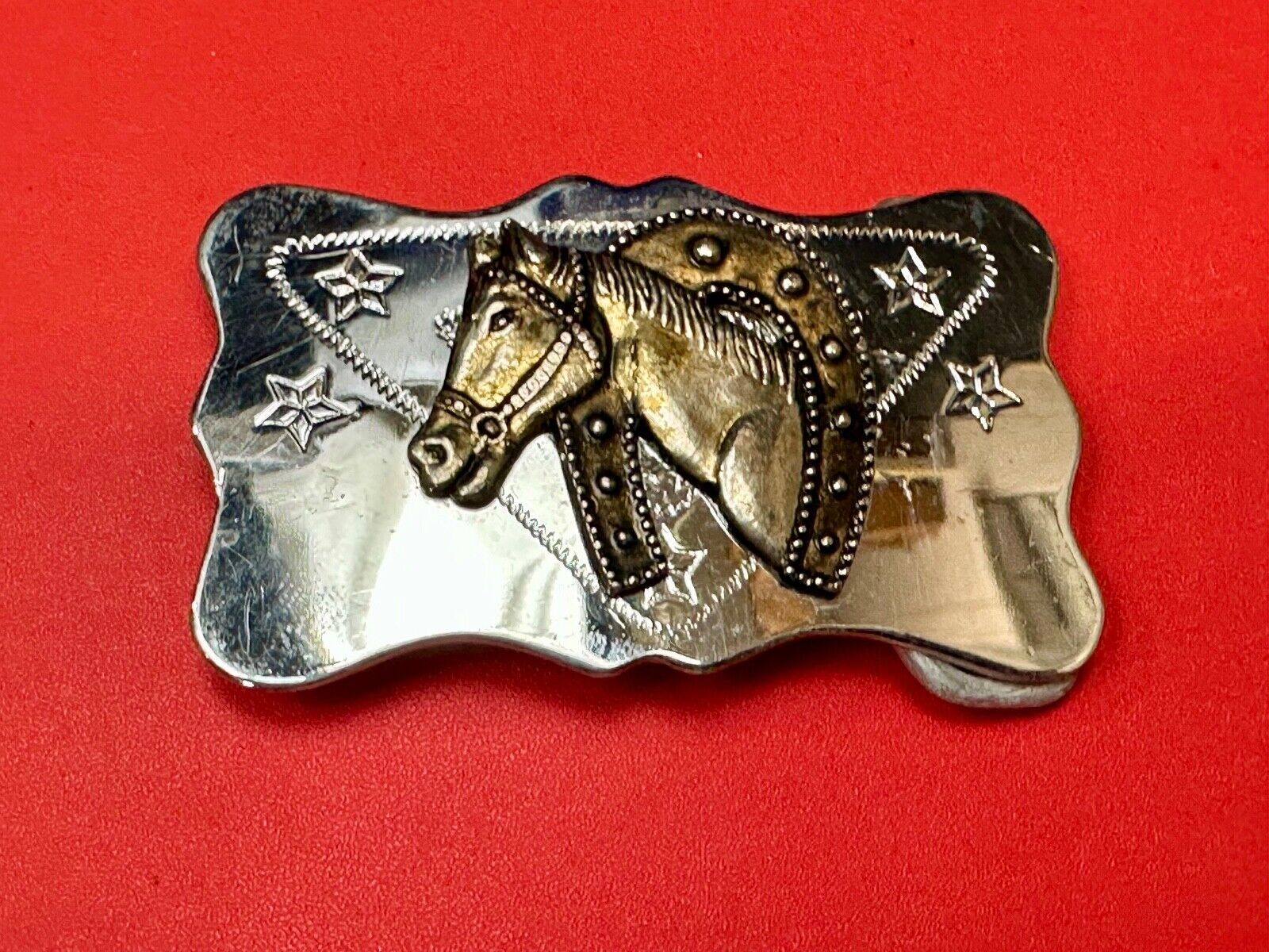 Vintage Horse head through horseshoe on reflective two tone belt buckle