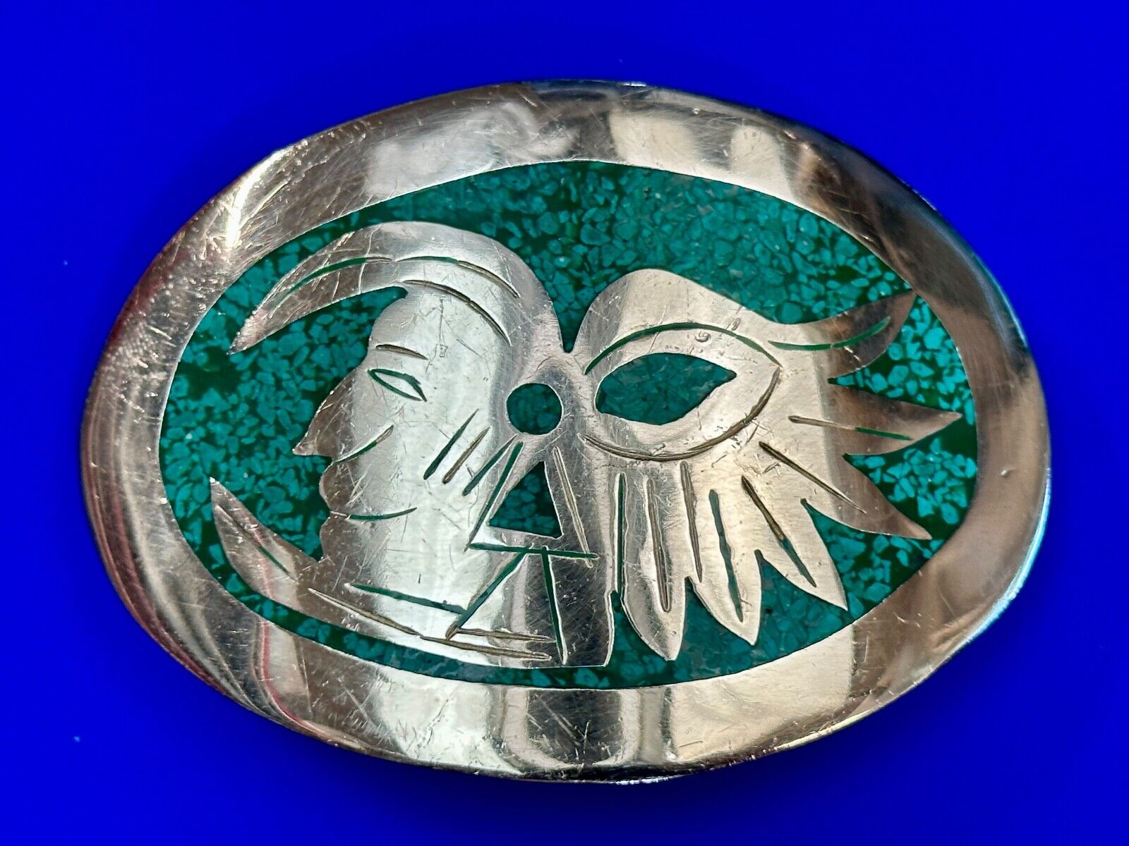 Tribal Face - Inlaid Turquoise chip to Alpaca stamped oval Belt Buckle