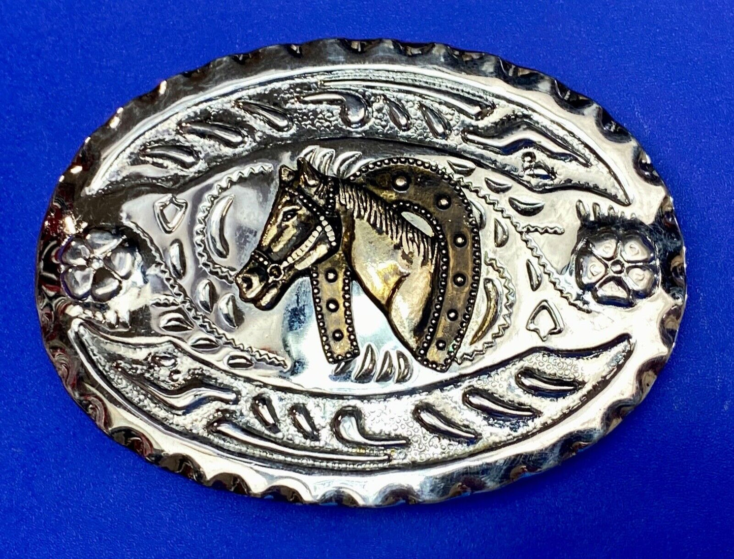 Vintage horse head through lucky horseshoe on mixed metal western belt buckle