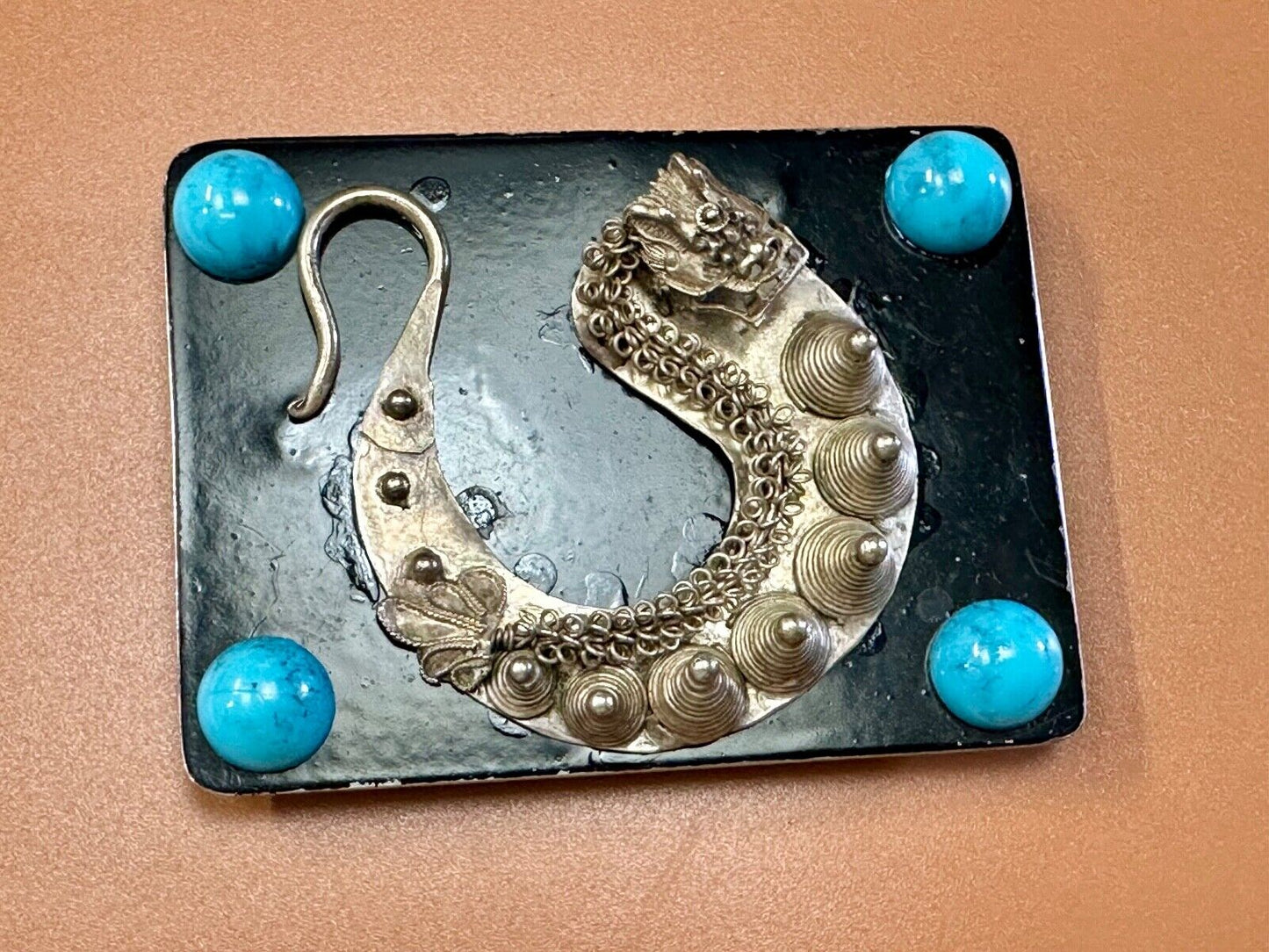 Artisan Dragon theme rectangular belt buckle with turquoise colored corner accts