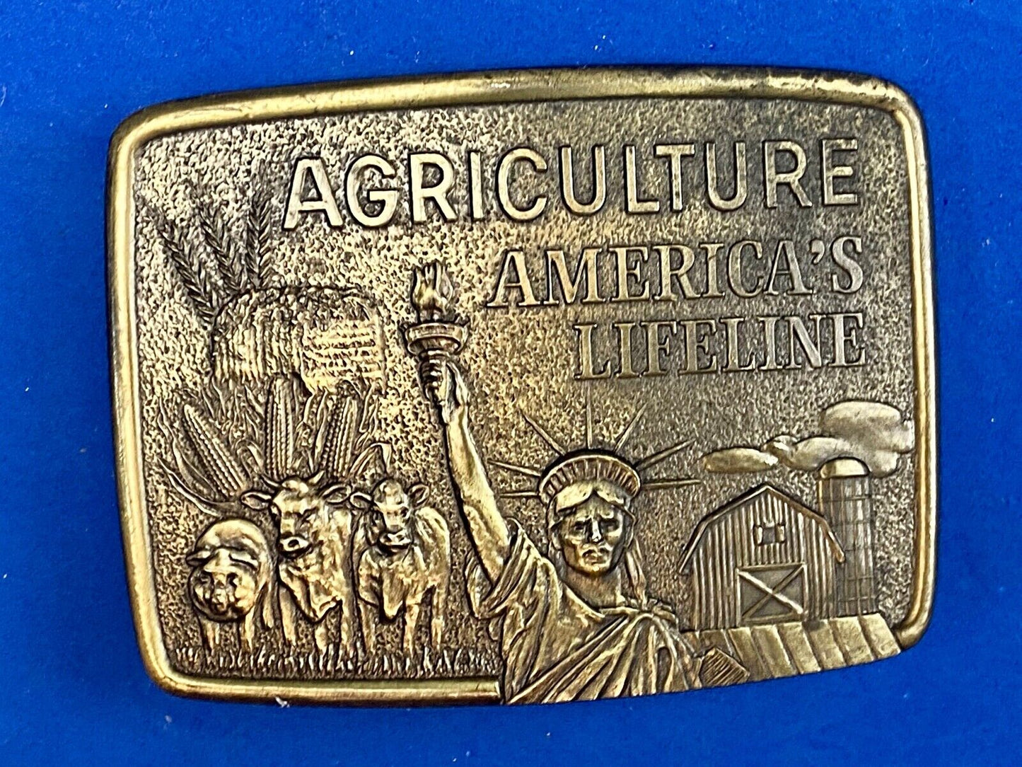 AGRICULTURE, Americas Lifeline belt buckle by Farmhand - Statue of liberty 