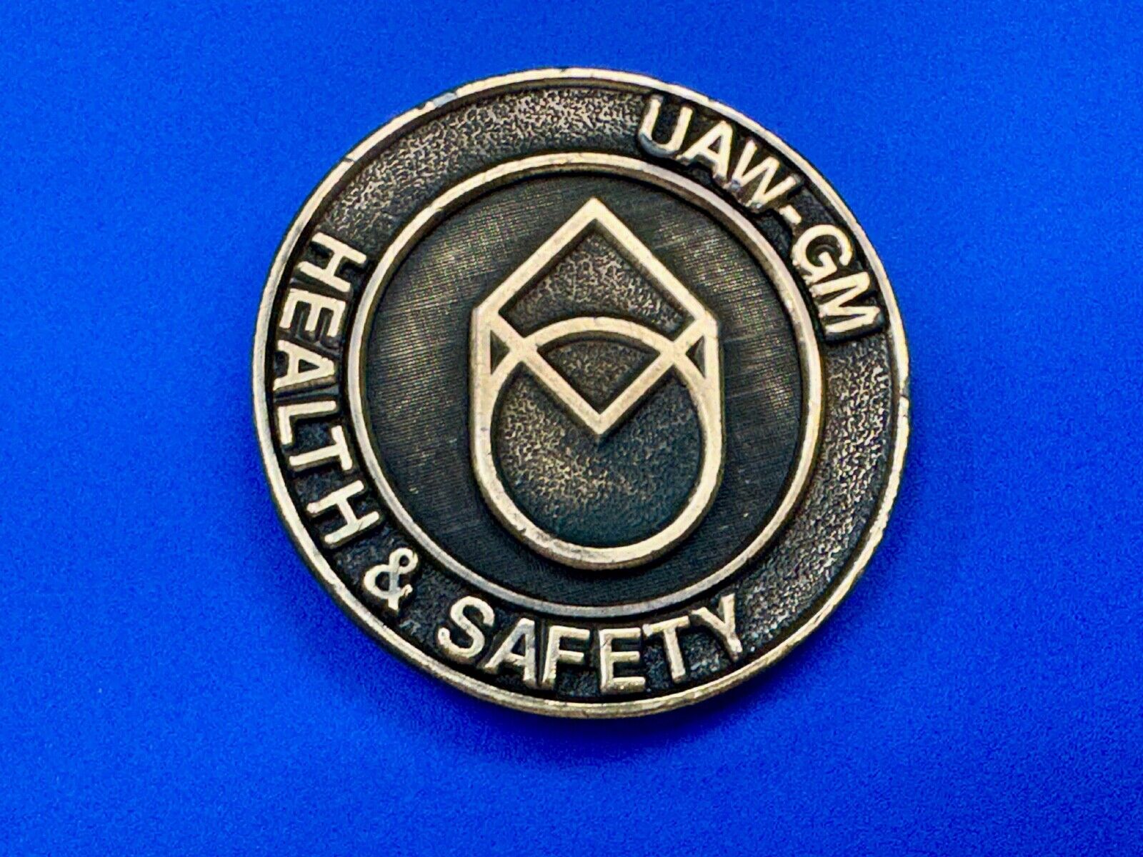 UAW-GM auto workers union round Health & Safety Award belt buckle