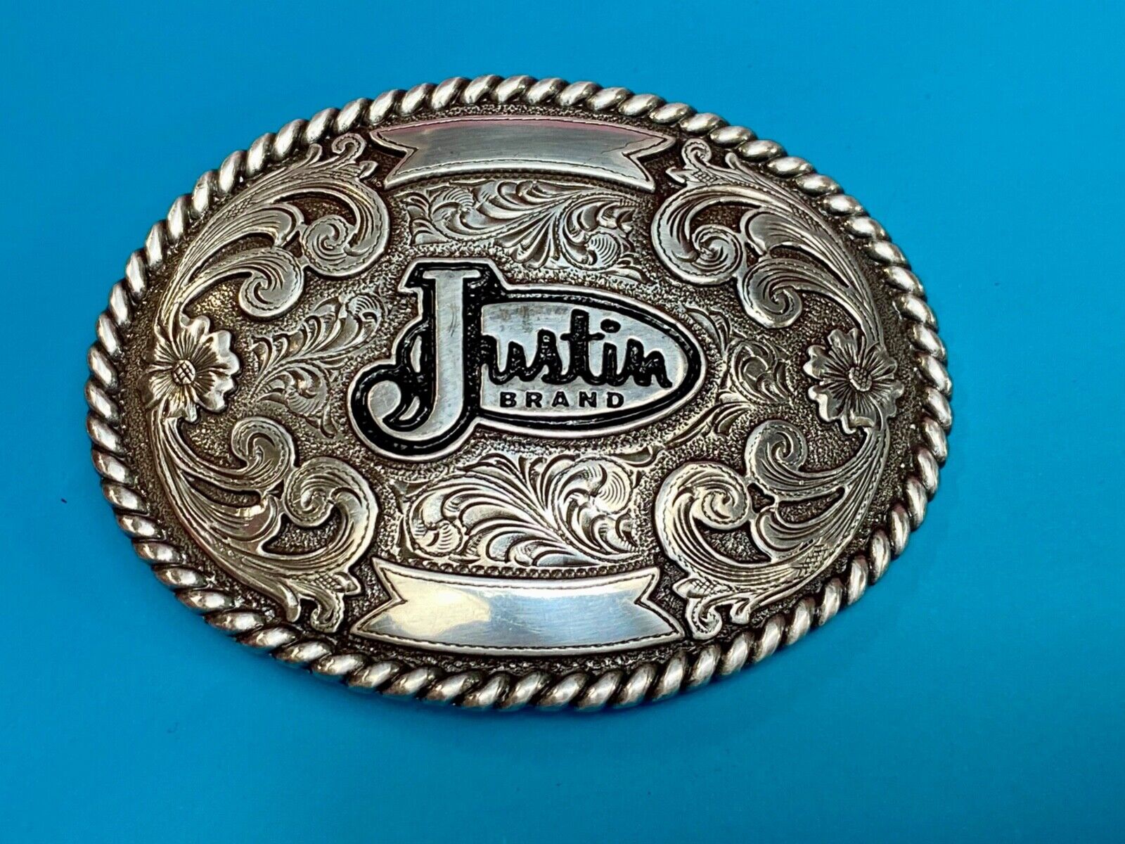 Vintage Justin Cowboys ornate flower swirl Belt Buckle with blank trophy scroll
