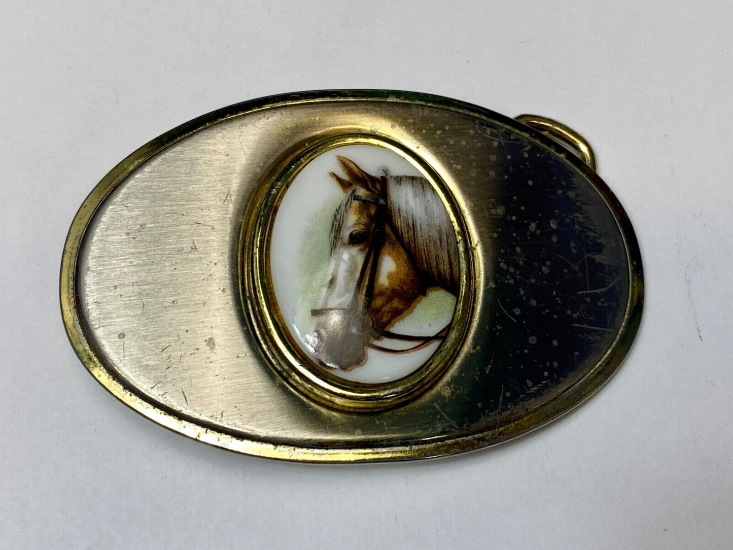 Vintage horse head picture centered in western belt buckle
