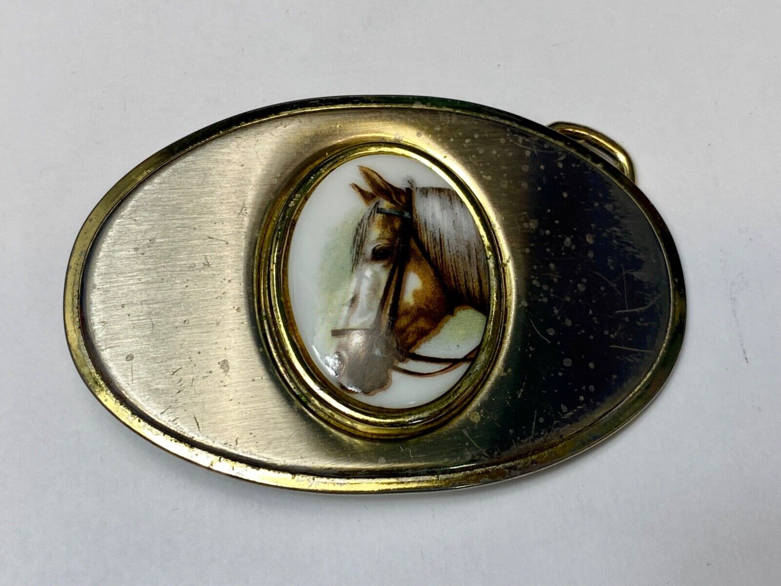Vintage horse head picture centered in western belt buckle