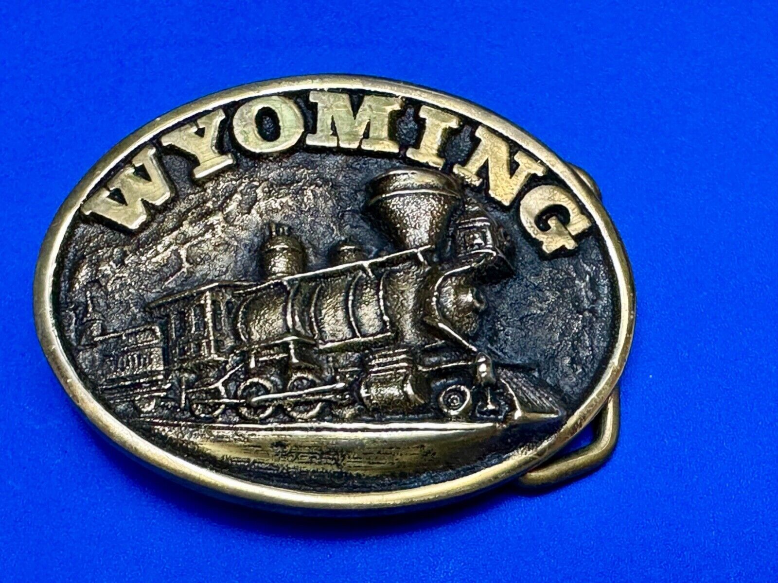 The great state of Wyoming Train History brass belt buckle by Heritage Mint LTD