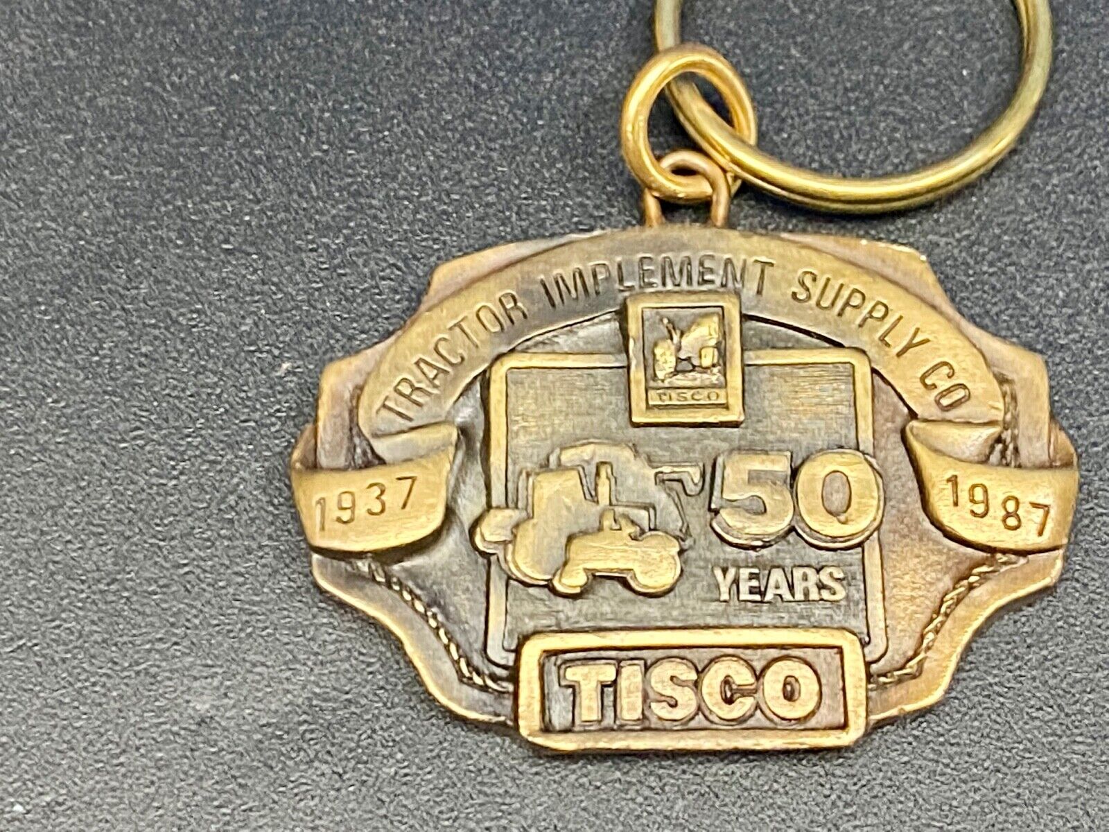 TISCO Tractor Implement Supply Co 50 year celebration NOS Keychain 