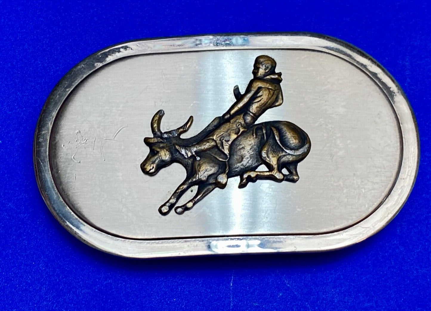 Vintage western oval Rodeo Cowboy on bucking bronc? bull numbered belt buckle