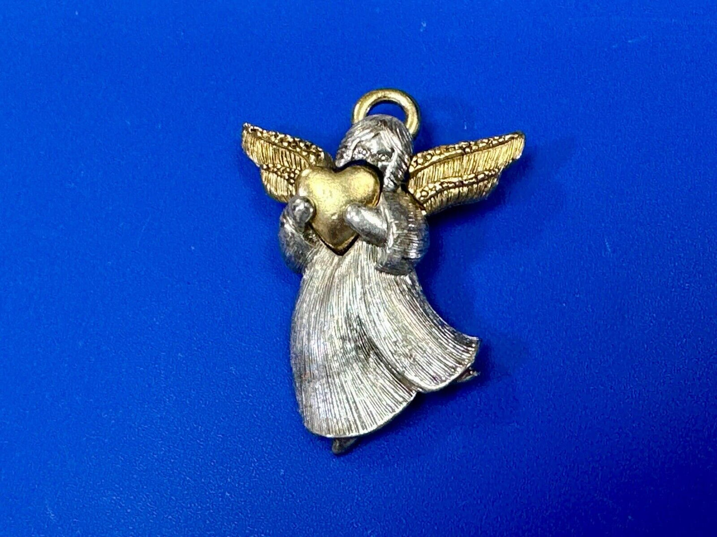 Angle holding heart -vintage two tone LC Liz Claiborne Signed Brooch Pin