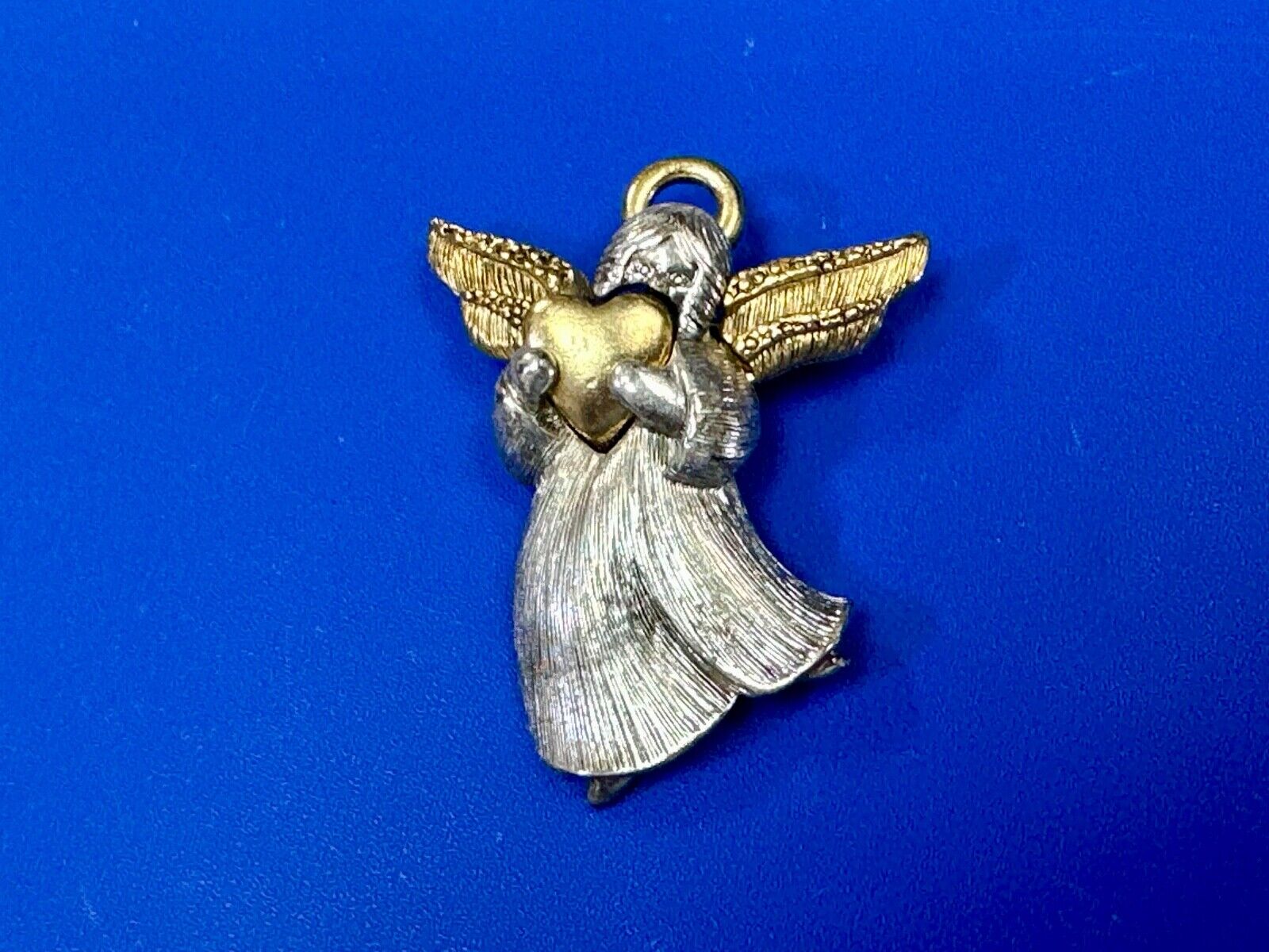 Angle holding heart -vintage two tone LC Liz Claiborne Signed Brooch Pin
