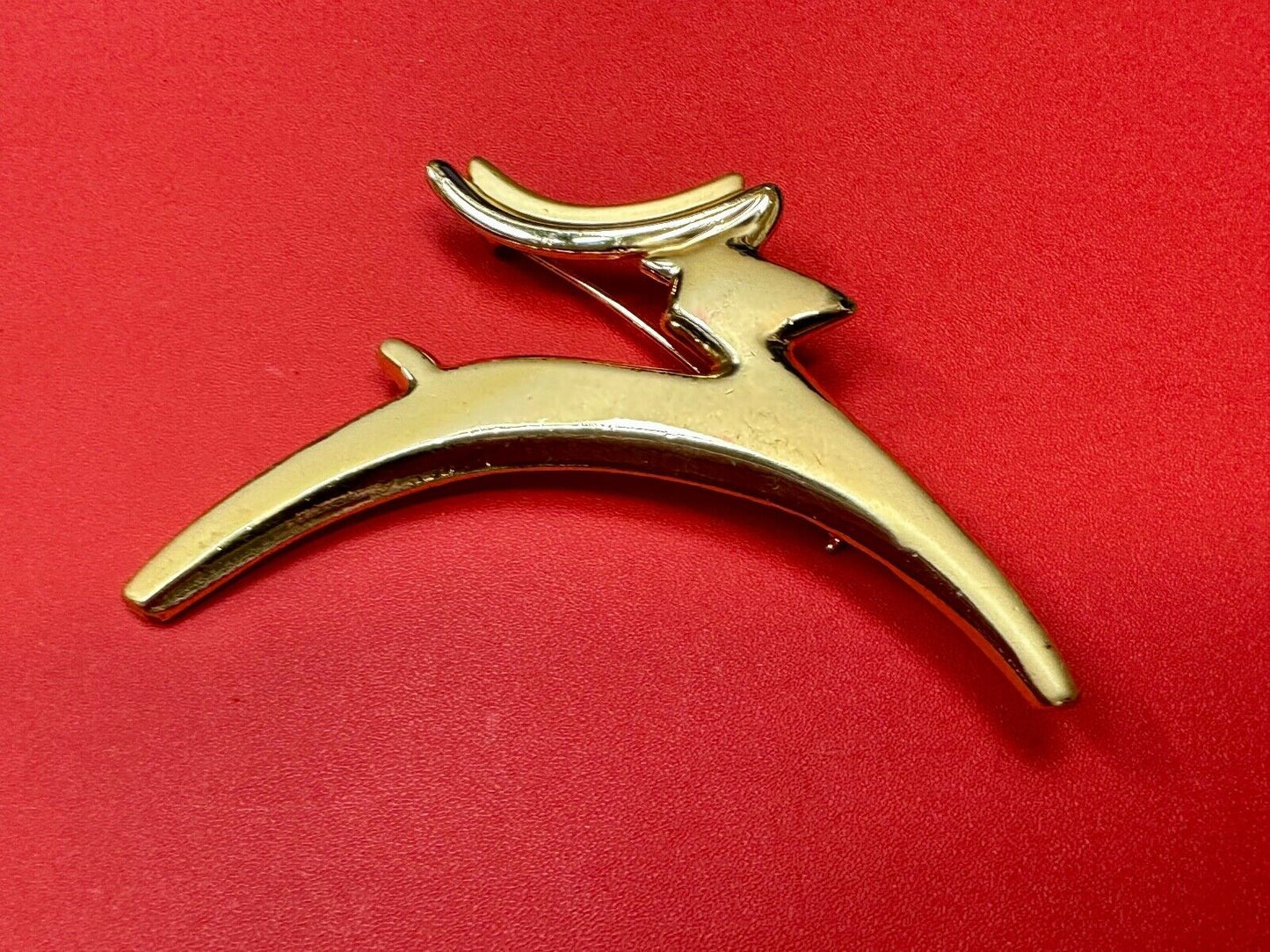 Abstract gold tone running deer - Vintage Christmas Holliday Brooch by AJC