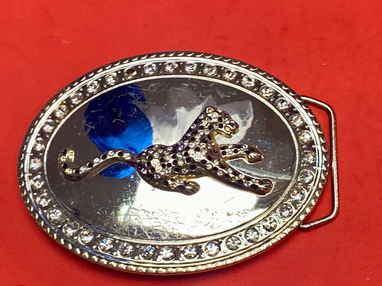 A big Tiger Cat running featured on western oval belt buckle 