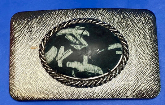 Black & white Oval Cabochon Conch centerpiece on Western belt buckle