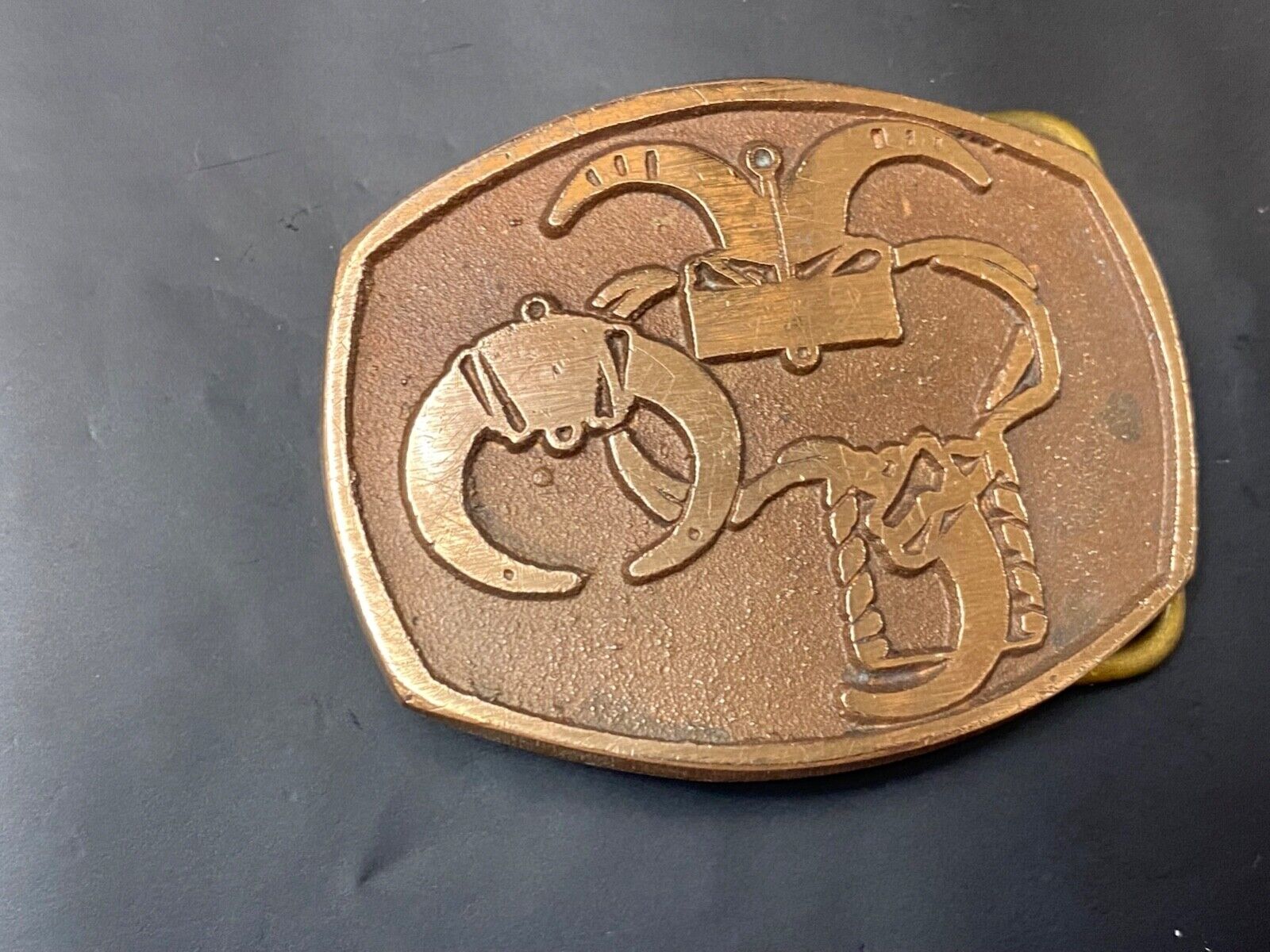 unknown to me - cattle branding symbols? longhorn western? belt buckle