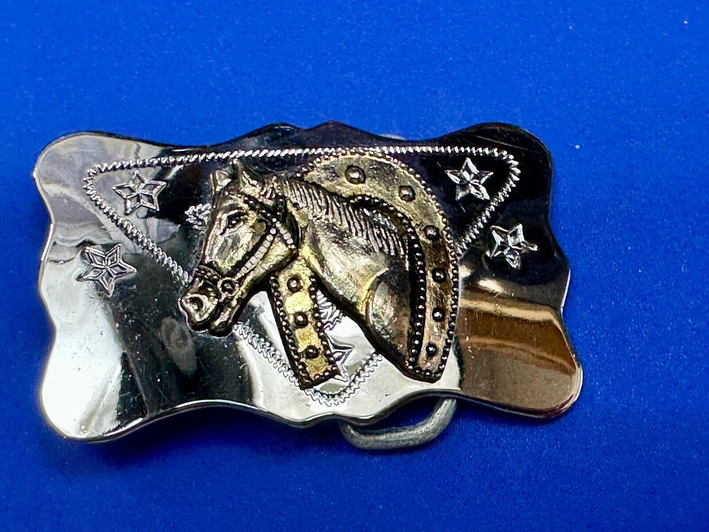 Vintage horse head through lucky horseshoe on reflective western belt buckle