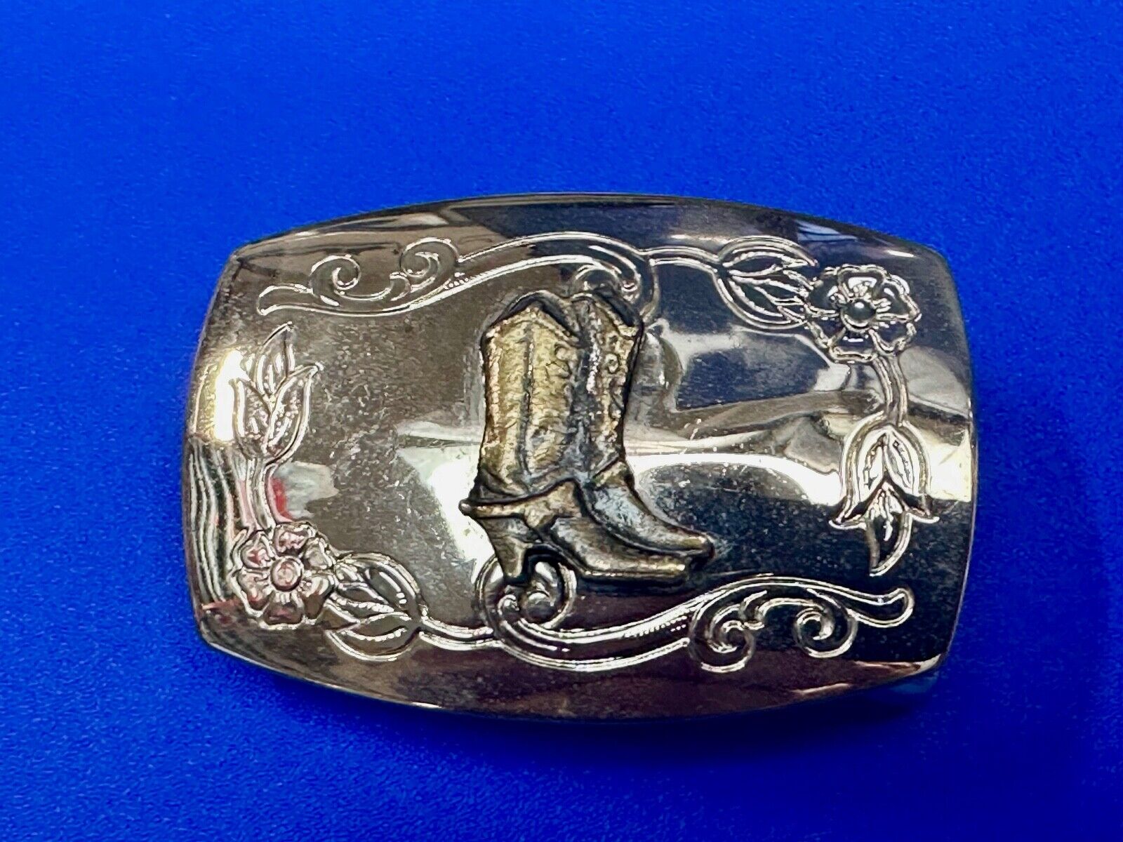USA made Western Cowboy boots on reflective two tone vintage belt buckle