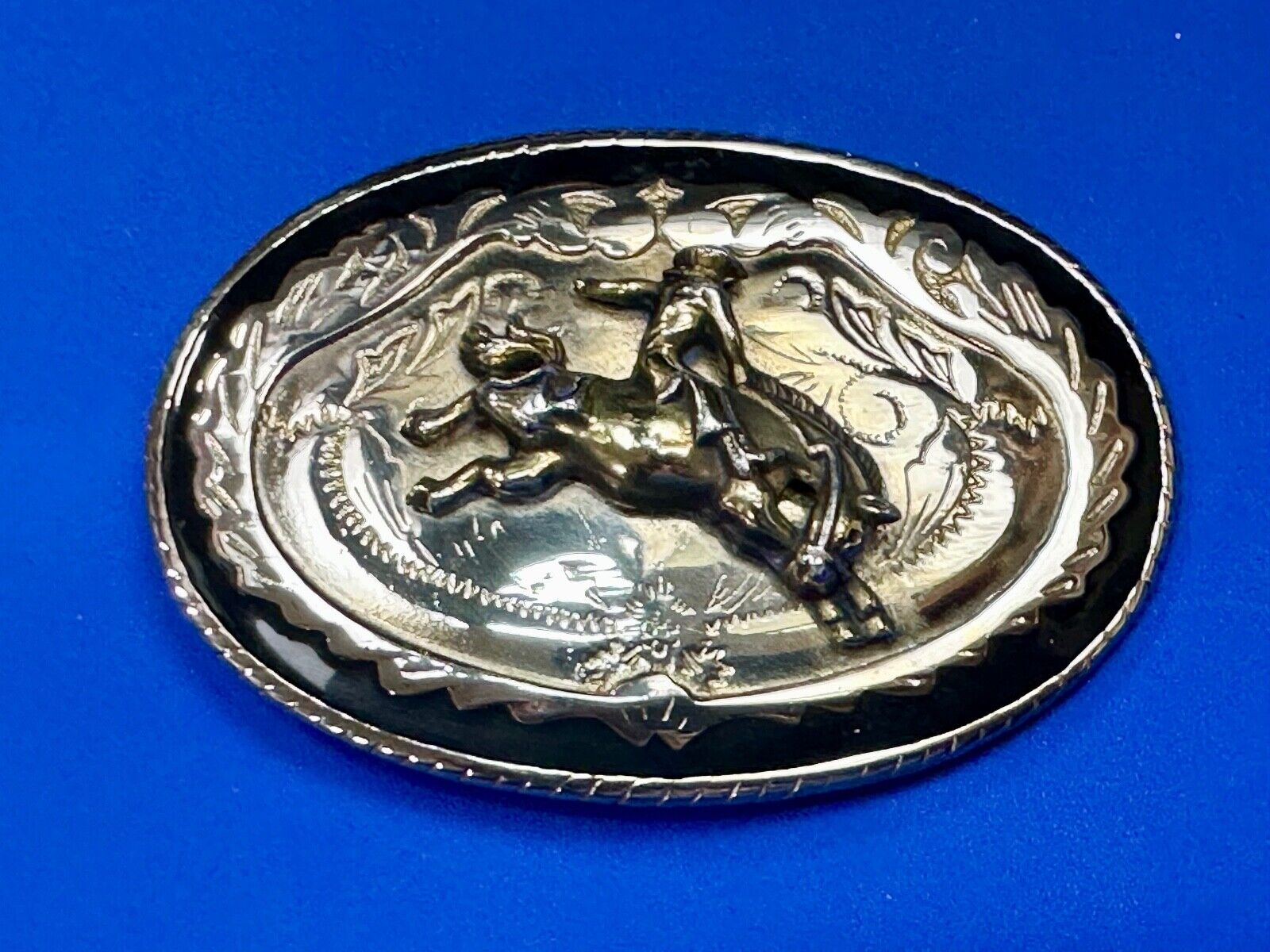 Beautiful Cowboy Saddle Bronc western black silver gold color belt buckle