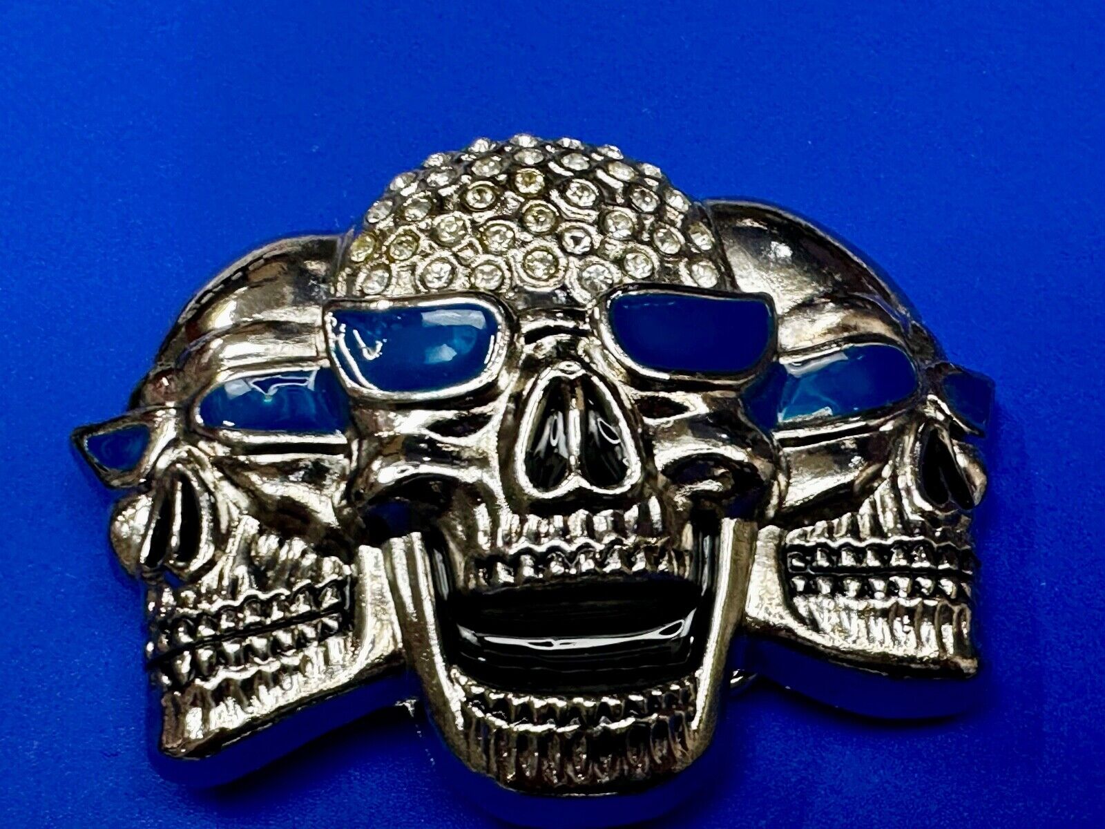 Three Skull's Heads Rhinestone Accented W/ Blue Shades Silver Tone Belt Buckle