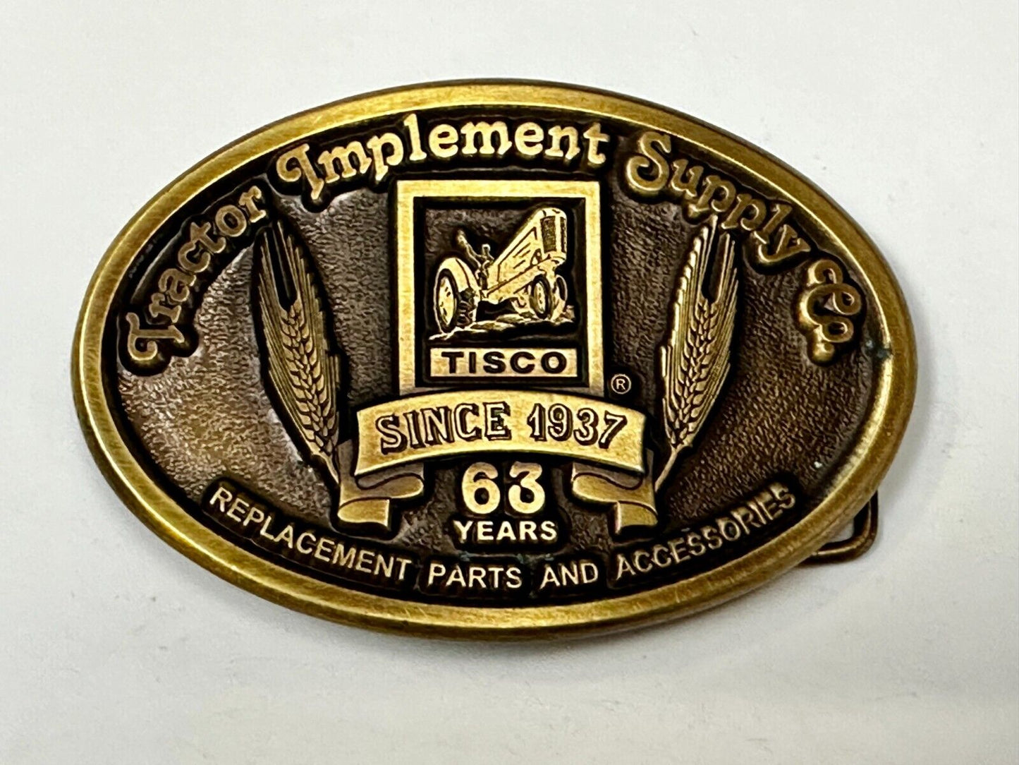 63 years TISCO Tractor Implement Supply company Vintage Belt Buckle by Speccast