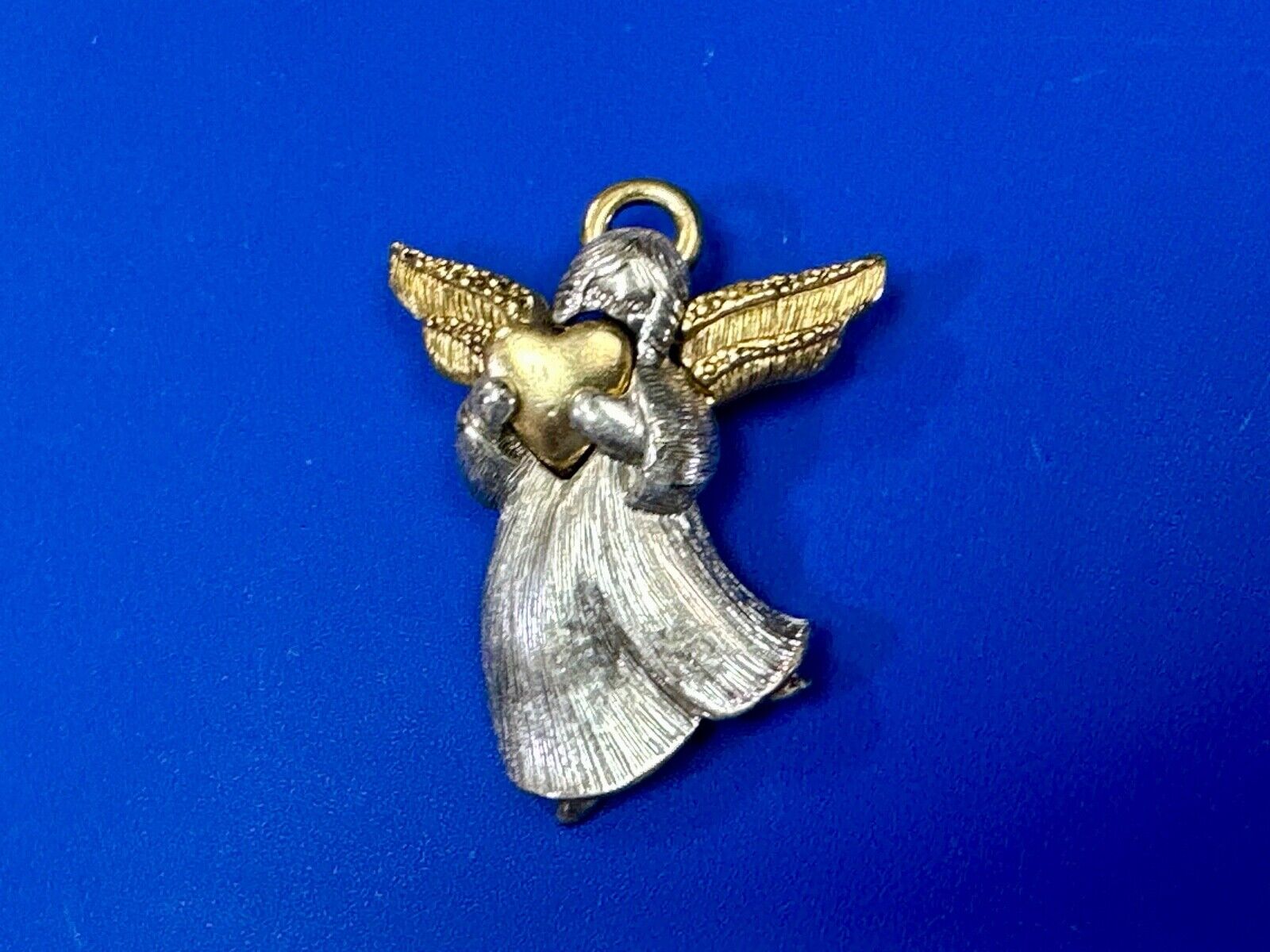 Angle holding heart -vintage two tone LC Liz Claiborne Signed Brooch Pin